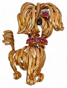 Van Cleef & Arpels 18K Gold Spaghetti Dog Pin: Van Cleef &amp; Arpels 18K yellow gold whimsical spaghetti dog brooch decorated with rubies, diamonds and enamel, marked  length 49 mm. total weight: 14.8 grams  Provenance: Property from a prominent