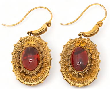 Victorian 14K Gold Etruscan Garnet Dangle Earrings: Victorian 14K yellow gold Etruscan garnet carbuncle dangle earrings, central gum drop garnet cabochon, acid tested length 25 mm. total weight: 11 grams Provenance: Property from the estate of