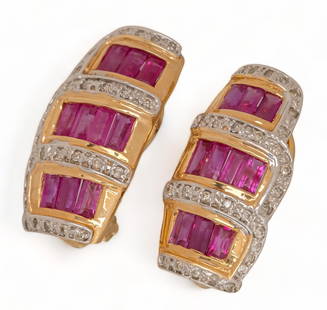 Ruby and Diamond 14K Gold Omega Clasp Earrings: Ruby and diamond 14K yellow gold omega clasp earrings, straight baguette cut rubies, round brilliant border set diamonds, marked length 23 mm. total weight: 6.9 grams Provenance: Property from