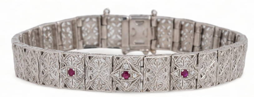 Art Deco 14K White Gold Filigree Ruby Bracelet: Antique 14K white gold filigree ruby bracelet with safety chain clasp, marked length 8 in. total weight: 26.8 grams Provenance: Property from the estate of life-long antique jewelry collector