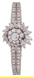 Rolex Ladies Limited Production 15 mm. Platinum and Diamond Vintage Watch: Rolex ladies limited production 1980's platinum and diamond vintage watch, set with 132 brilliant cut diamonds tapering in weight (.02/100 ct to.10/100 ct) at top of bracelet next to case, 18 marq