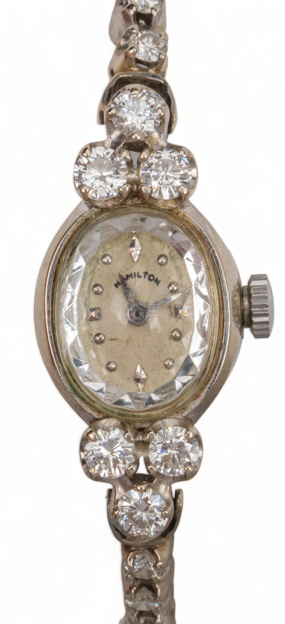 Hamilton 14K Gold Graduated Diamond Band Watch: Vintage Hamilton 14K white gold graduated diamond band watch, automatic length 7 in. total weight: 17.4 grams Condition: running; as with all vintage pre-owned watches, service recommended Provenance: