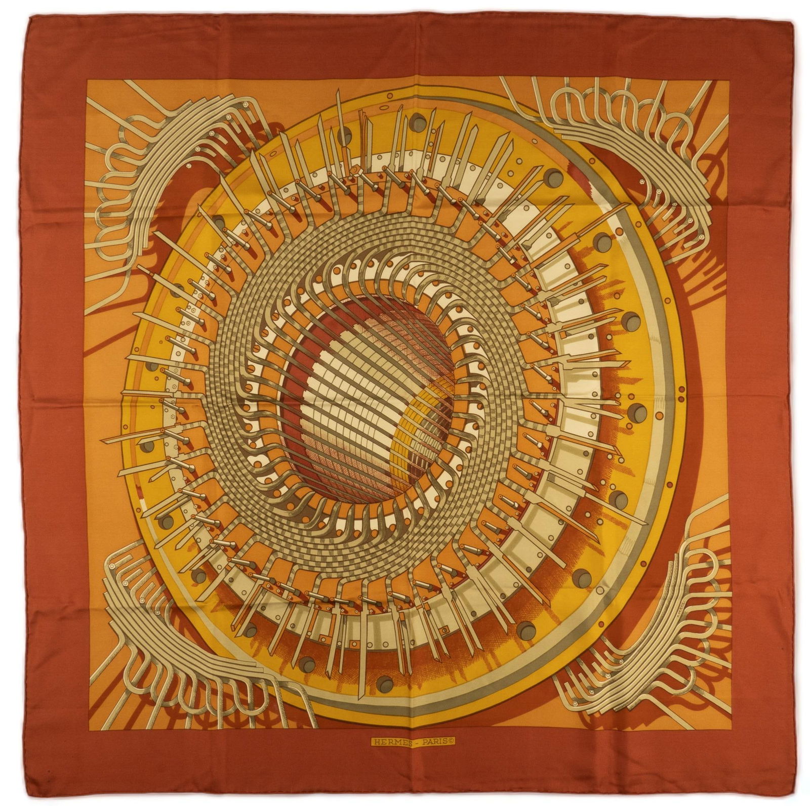 Hermes Paris Alternateur Silk Scarf: Hermes Paris Pierre Peron "Alternateur" silk scarf of circular loom machine graphic motif in ocher yellow and amber; first edition created in 1971 Square 35 in. Provenance: Property from a