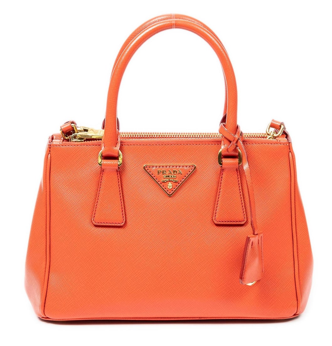 Prada Galleria Double Zip Mini Bag Shoulder Bag: Prada Galleria Double Zip Mini shoulder bag of orange Saffiano calfskin leather with leather handles, and gold tone hardware; marked BN2896, includes shoulder strap, card, and clochette with charm 9.