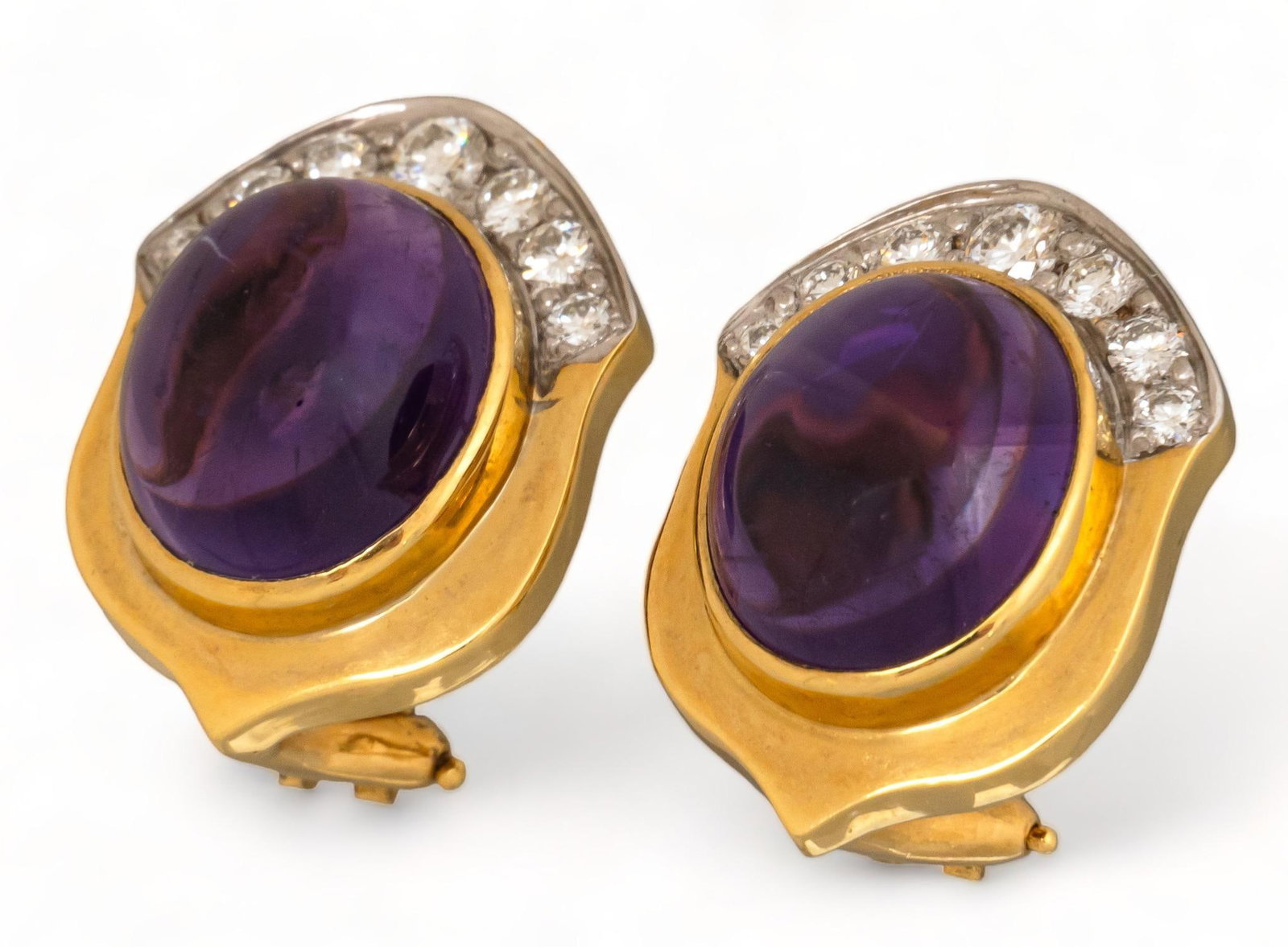 18K Gold Amethyst Gum Drop Cabochon Half Diamond Bezel Earrings: Amethyst gum drop cabochon half diamond bezel 18K yellow gold earrings, seven (7) round brilliant diamonds each, omega clasp backs, marked length 21 mm. total weight: 10.8 grams Provenance: Property f