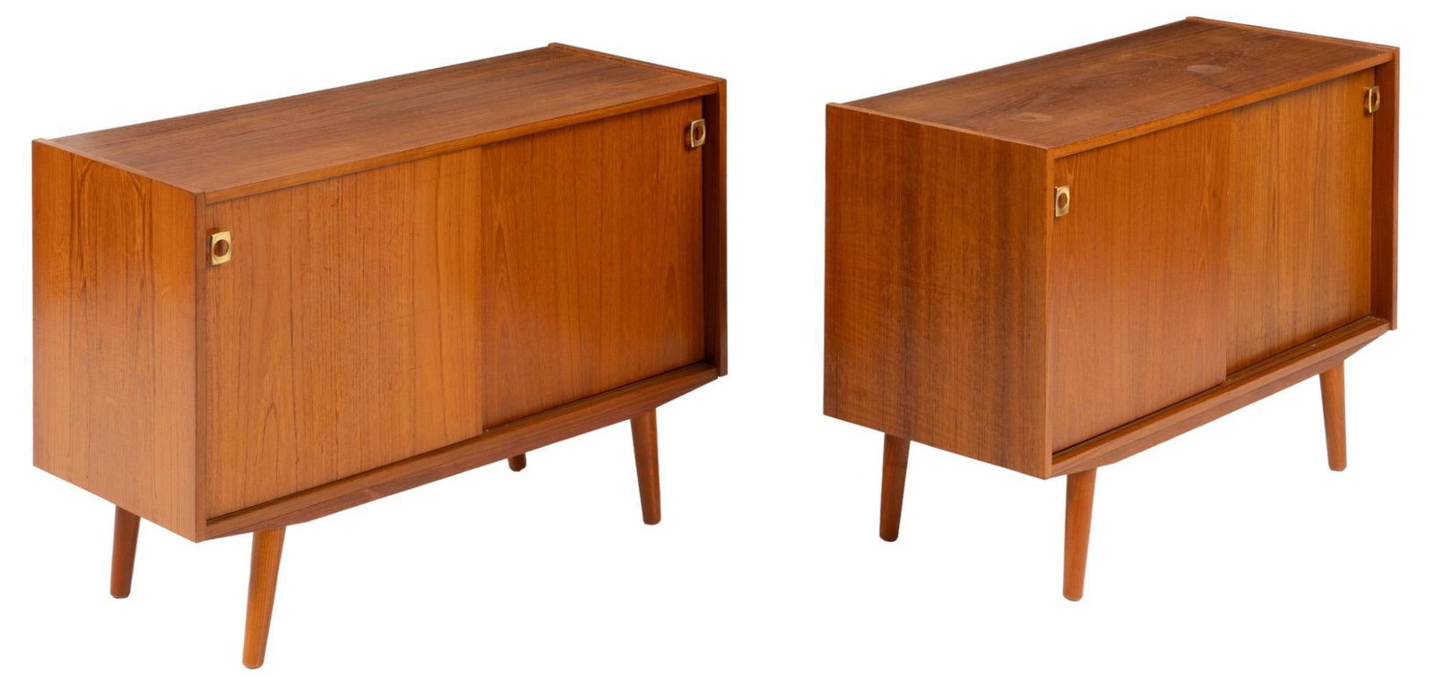 Pair of (2) Danish Mid-Century Credenzas: Pair of two (2) Danish Mid-Century credenzas, two siding doors with internal shelf, supported by tapered pin legs height 28 in. x width 39.5 in. x depth 16.5 in. We happily provide seamless shippin