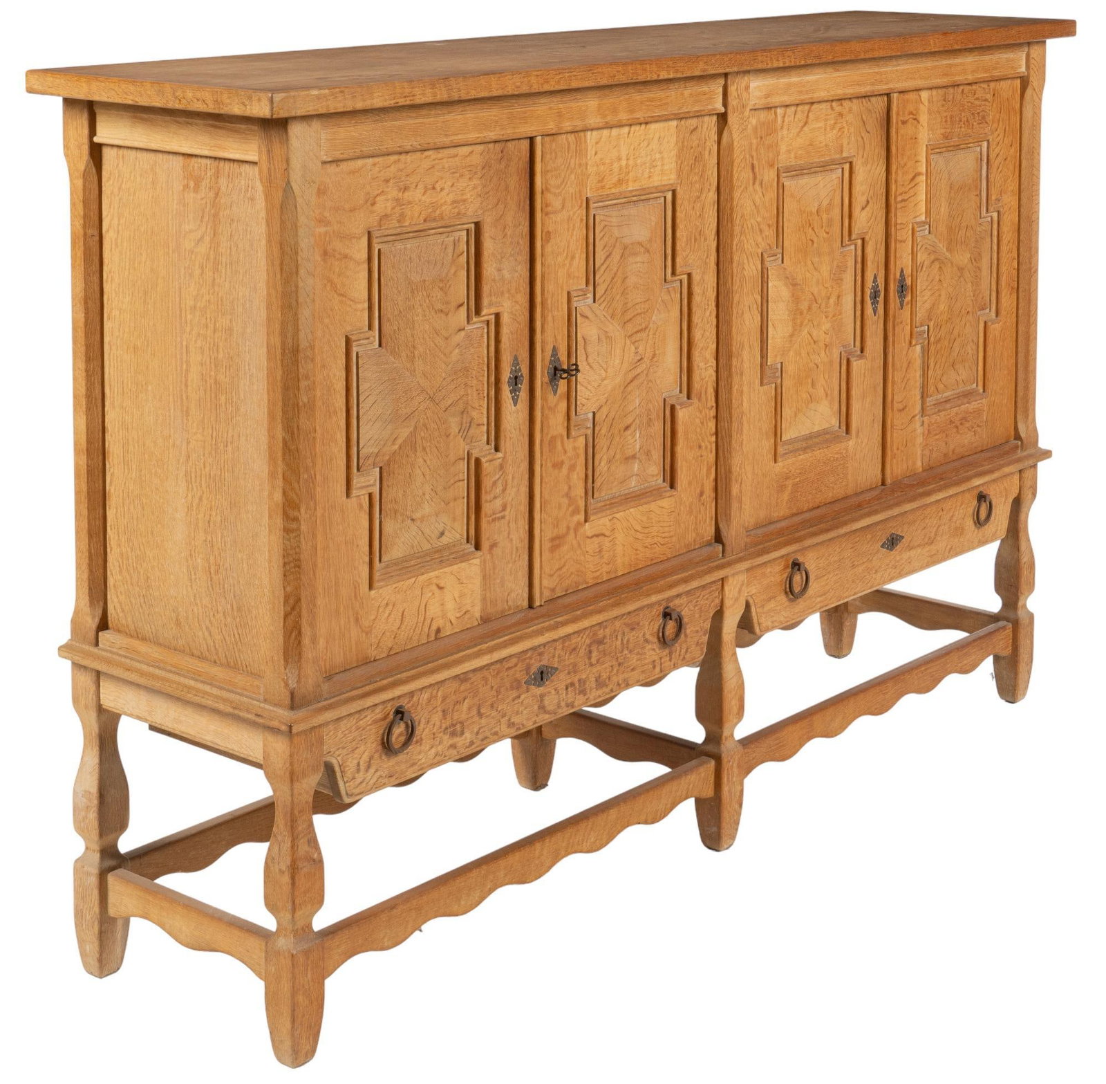Henning Kjaernulf Style Credenza: Danish Mid-Century credenza / sideboard, in the style of Henning Kjaernulf, with thick top, over four doors, featuring carved cruciform motifs, opening to three right-side drawers, three left-side dra
