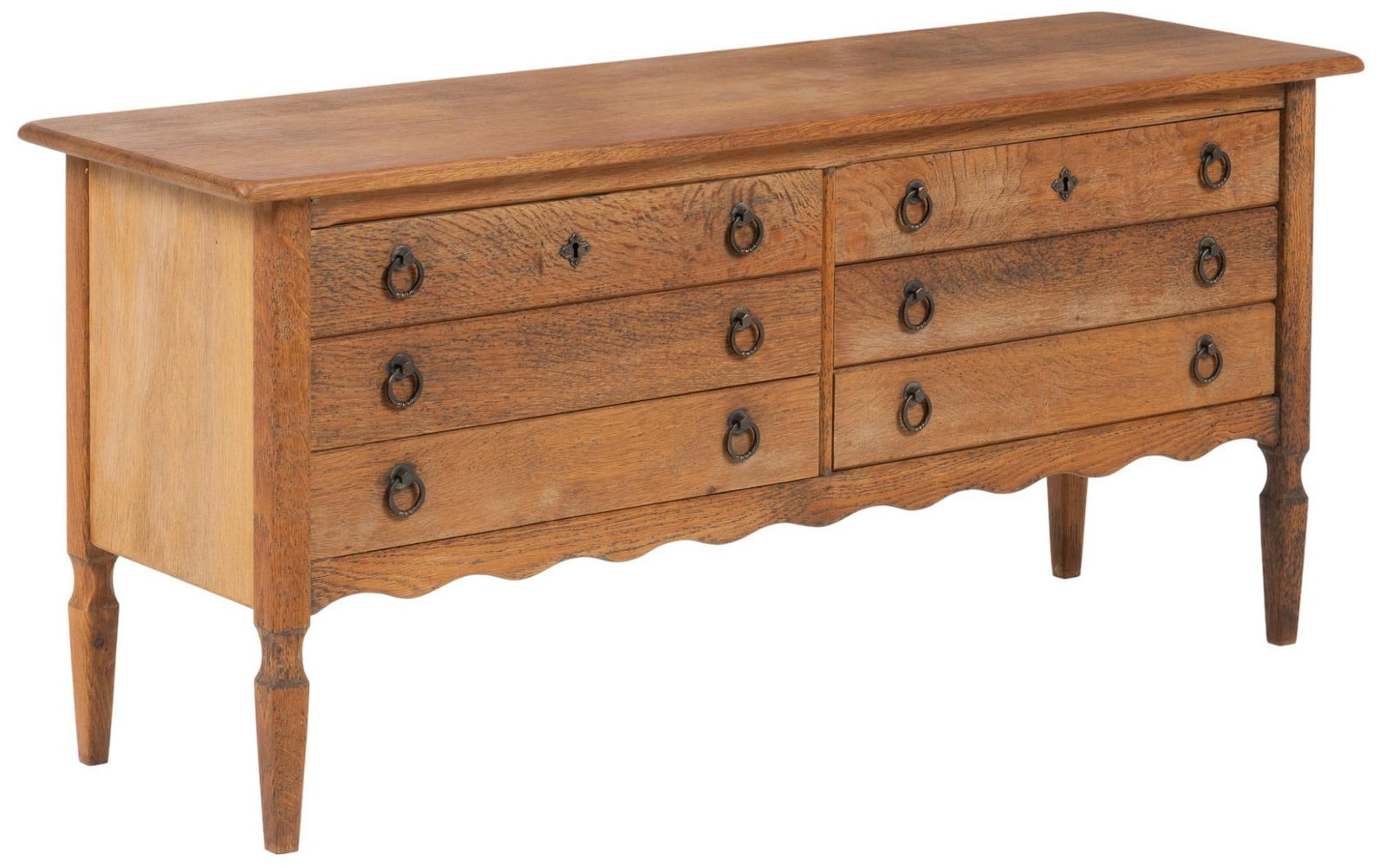 Henning Kjaernulf Style Danish Credenza: Danish Mid-Century credenza / sideboard, in the style of Henning Kjaernulf, with oversize top, over two stacks of three drawers, featuring scalloped apron, on tapered legs height 25 in. x width 51 in.