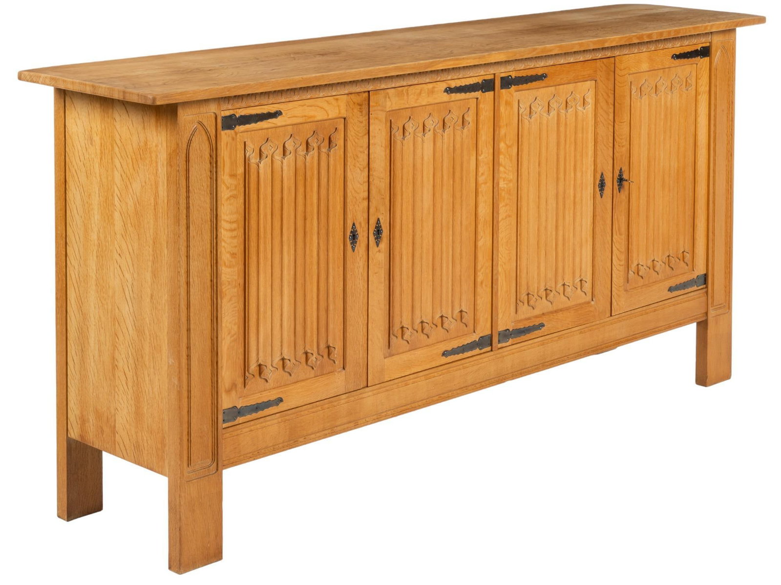 Danish Mid-Century Credenza: Danish Mid-Century credenza, with oversize rectangular top, above four cabinet doors with metal accents and carved design, opening to internal storage with two shelves, with left side also featuring f