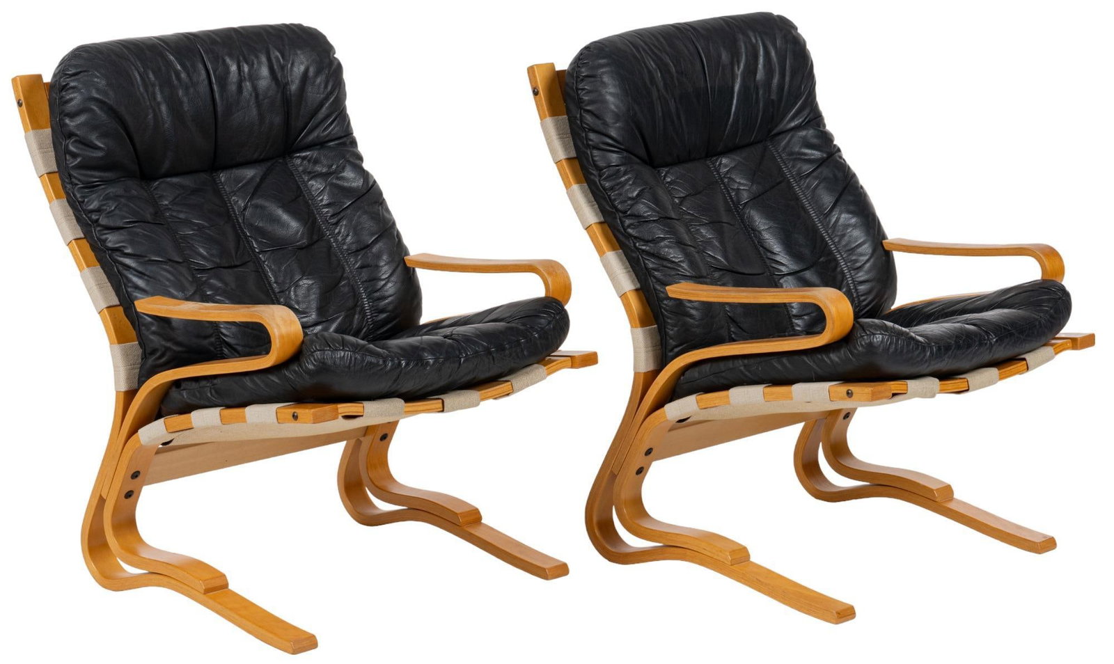 Pair of Danish Mid-Century Lounge Chairs: Pair of Danish Mid-Century lounge chairs, with black leather upholstery, supported on bentwood frames with cantilever legs height 37 in. x width 25 in. x depth 30 in. We happily provide seamless shipp