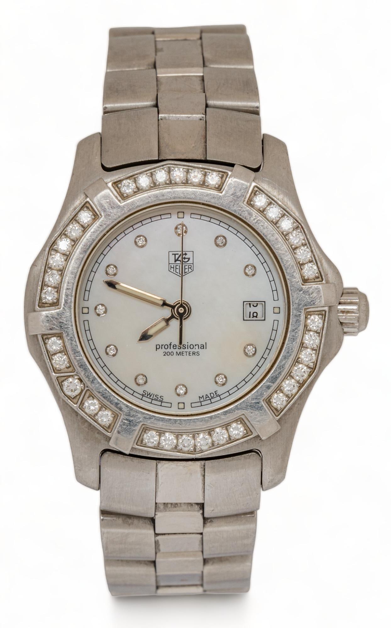 Tag Heuer Professional Aquaracer 27 mm. Diamond Bezel Watch: Tag Heuer professional Aquaracer 27 mm. diamond bezel watch, 2000 quartz, WN131J, SB5428, fourty-five diamonds case / 27 mm. length 6.25 in. Provenance: Property from the estate of a San Antonio, Te