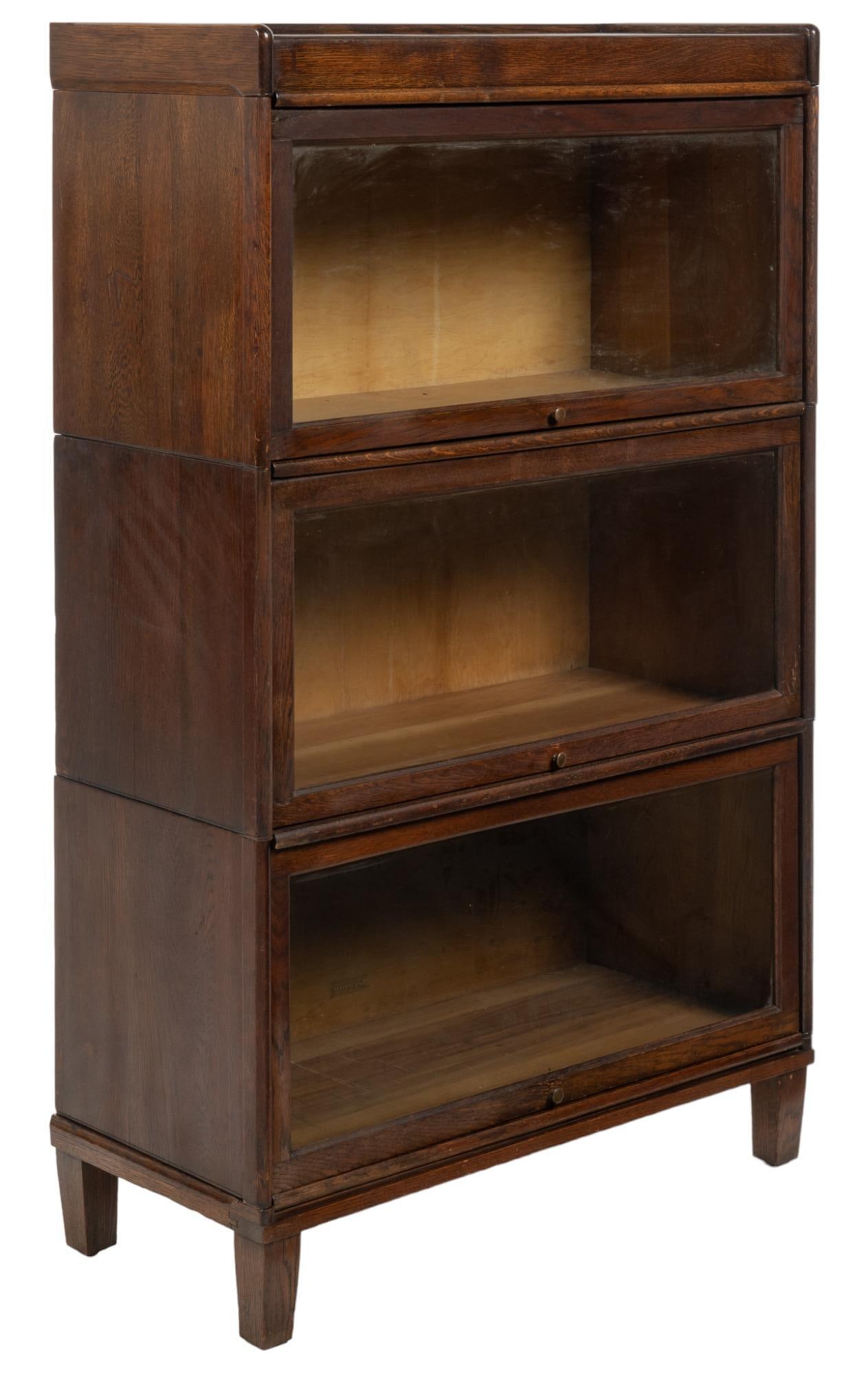 Stacking Bookcase: Stacking bookcase, with three units, glazed fronts height 55 in. x width 33.5 in. x depth 15 in. Provenance: Property from an Olmos Park, Texas estate Shipping available for this lot through our partn