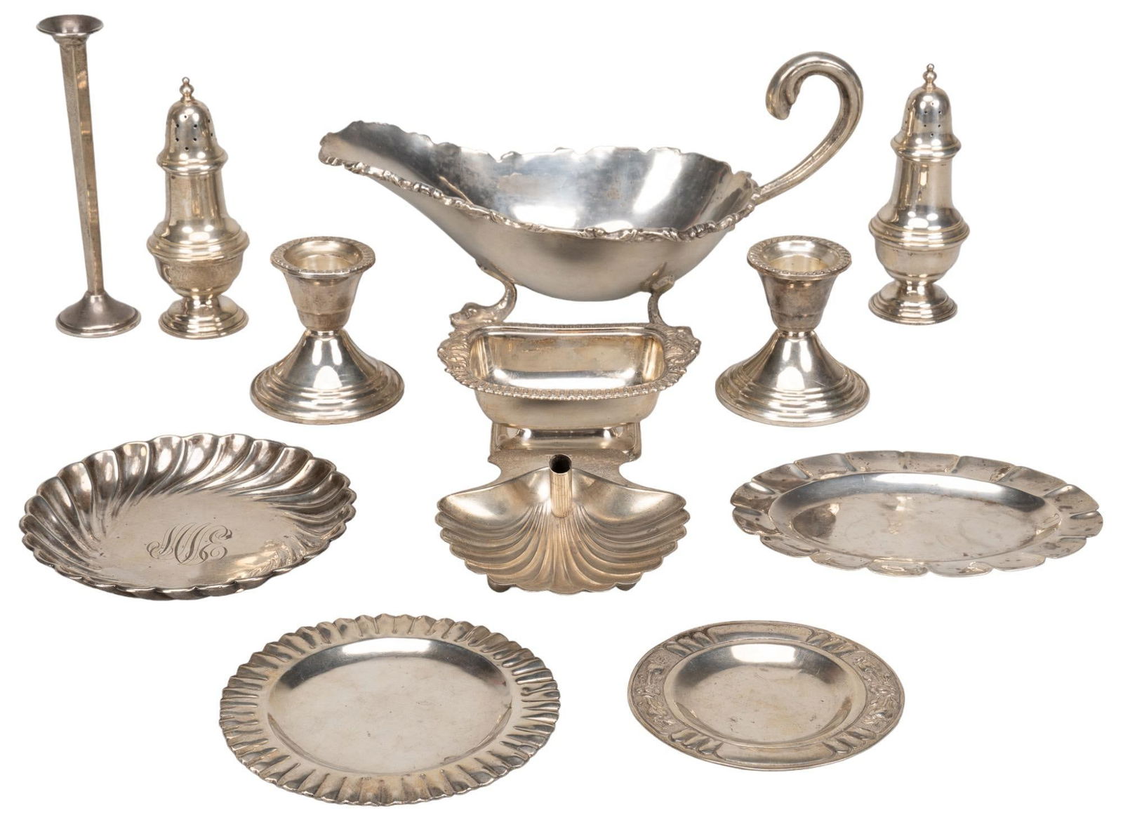Collection of (11) Sterling Silver Pieces: Collection of sterling silver pieces, to include two Wallace Silversmiths mufineers, marked on base, one gravy boat, featuring mounted figural Renaissance style dolphin feet, marked, two weighted cand