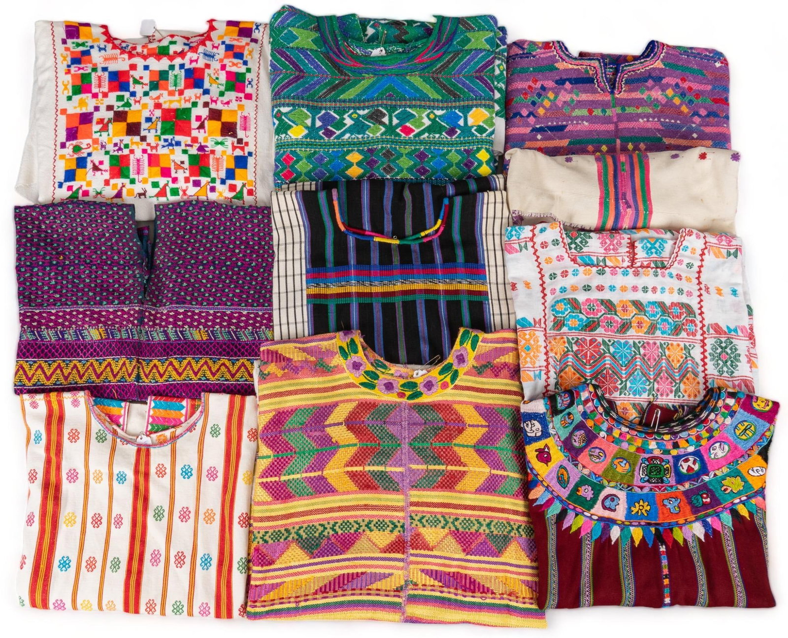 Collection of Huipiles: Collection of embroideredhuipiles, in different sizes and lengths Provenance: Property from a historic home in the Monte Vista neighborhood of San Antonio, Texas Shipping available for this lot throug