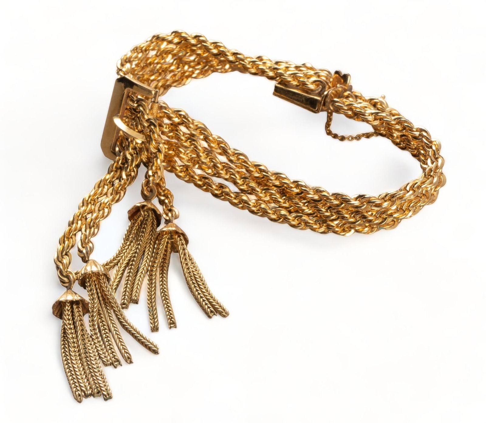 Vintage Gold Rope Chain Buckle Bracelet: Vintage gold filled rope chain buckle bracelet with tassels and integratedbox clasp, marked 12KGF length 7.25 in. total weight: 46.7 grams Provenance: Property from the estate of a San Antonio, Texas 