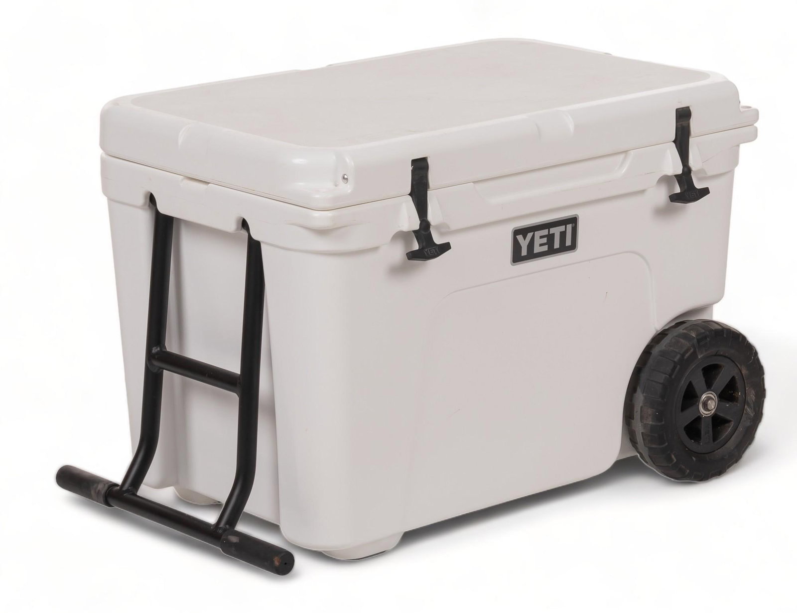 YETI Tundra Haul Wheel Cooler: YETI Tundra Haul Wheel Cooler in white, with handle, marked "Certified Bear Resistant", fits 82 cans (only), fits 64 lbs of ice (only), and features wine bottle compatibility height 19.5 in. x