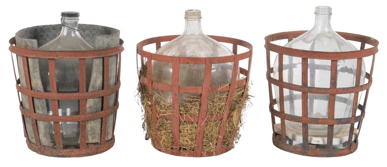 Group of (3) Carboys: Group of three carboys, housed in iron baskets, lined with hay height 25 in. x diameter 21.5 in. Shipping available for this lot through our partner 4CL; please request a shipping quote at shipping