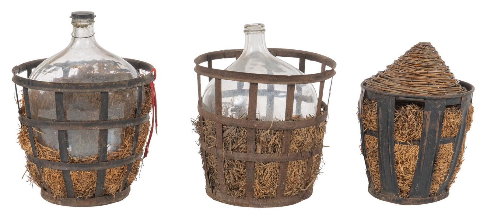 Set of (3) Carboys in Baskets: Set of three carboys in baskets, housed in iron baskets, lined with hay height 27 in. x diameter 20 in. / tallest Shipping available for this lot through our partner 4CL; please request a shipping quo