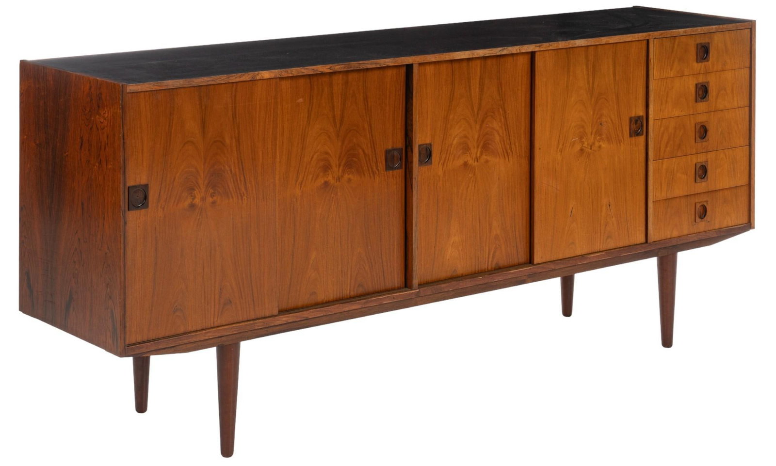 Danish Mid-Century Credenza: Danish mid-century credenza / buffet with black finish wood top above two pairs of sliding doors on the left and middle section opening to shelved interiors, beside right section featuring five stacke