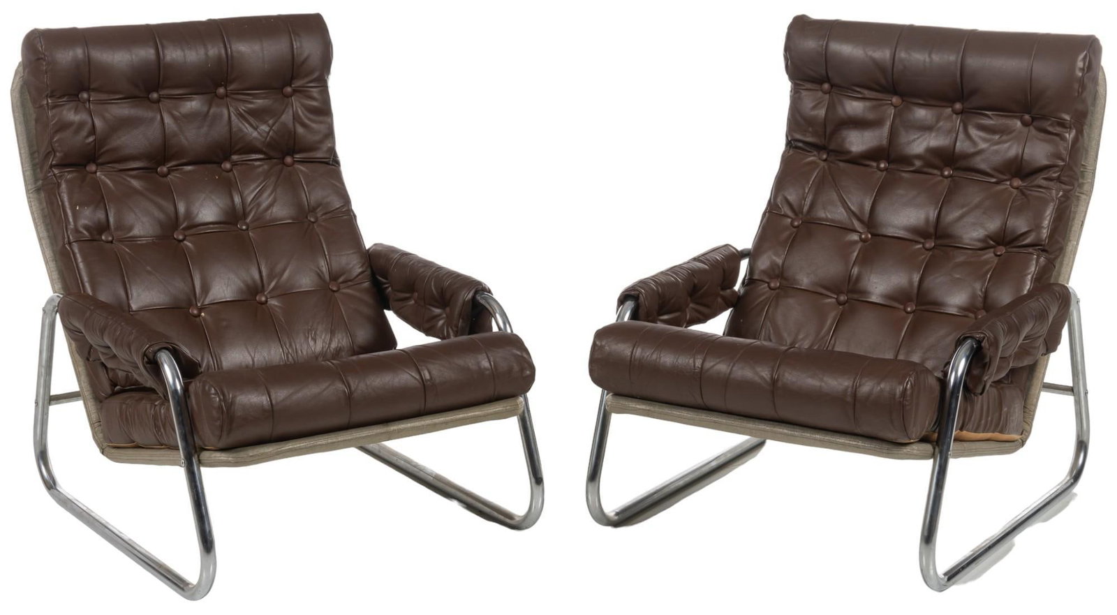 Pair of Danish Mid-Century Chairs: Pair of Danish mid-century lounge chairs featuring cushions of tufted brown leather, supported on bent chrome legs height 32 in. x width 26.5 in. x depth 33 in. / each Shipping available for this lot 