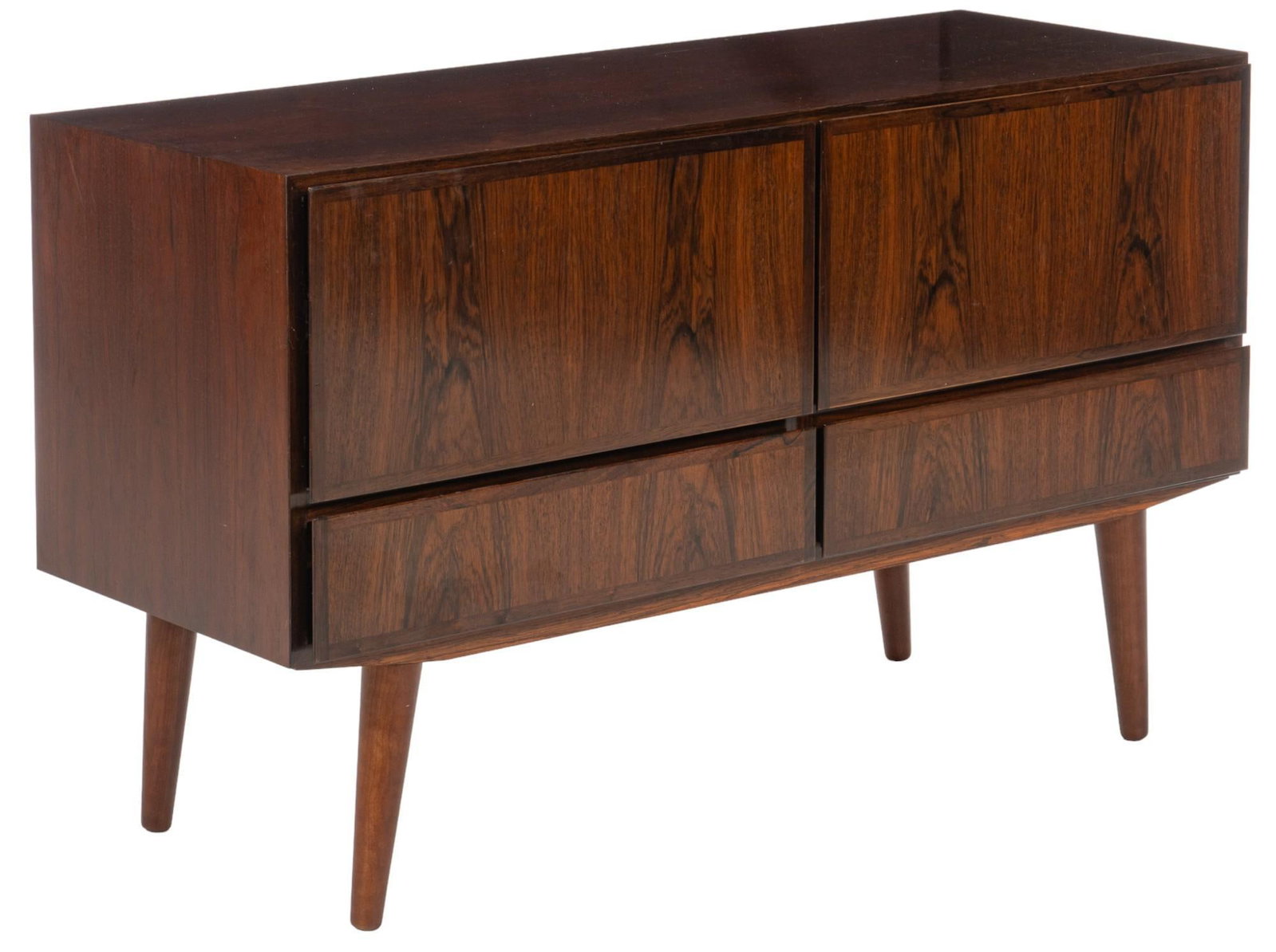 Danish Mid-Century Credenza: Danish mid-century credenza featuring four drawers, supported on splayed pin legs, with care instruction note that translates to read "Note! In each corner of the lower cabinet there is an adjusti