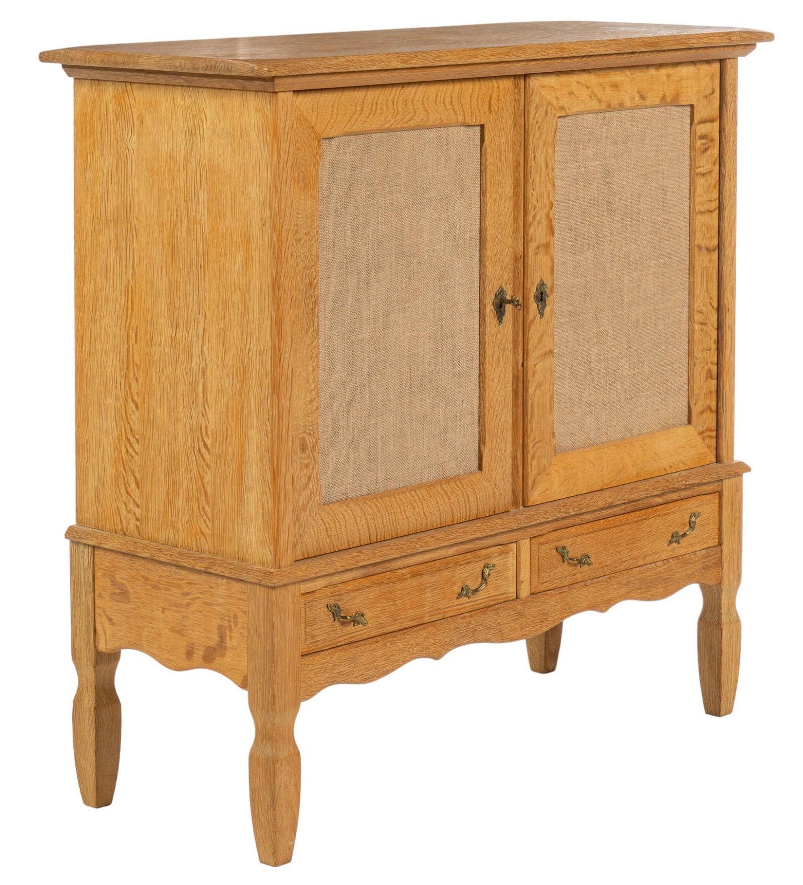 Henning Kjaernulf Style Credenza: Henning Kjaernulf style mid-century credenza / cabinet featuring oversize top above pair of wood panel doors clad in burlap fabric, opening to interior storage with four shelves, over pair of drawers 