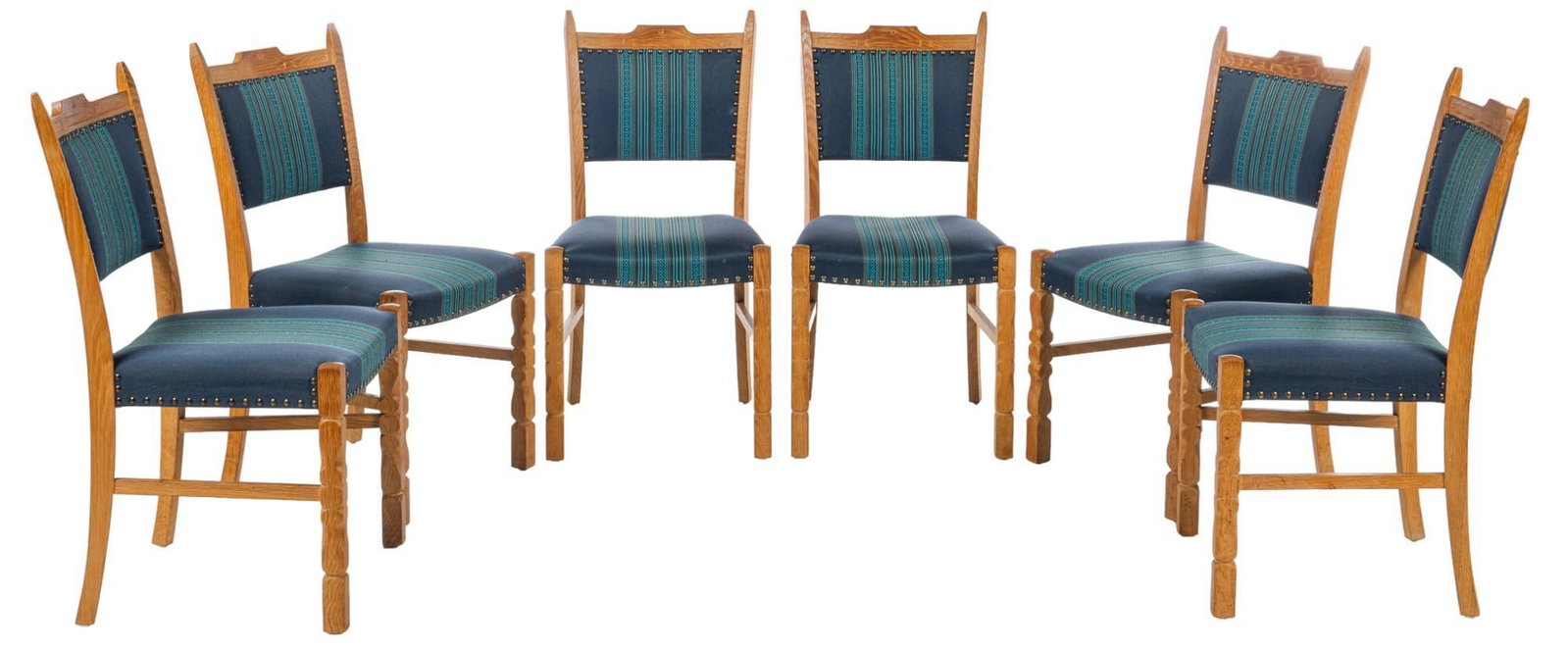 Set of (6) Henning Kjaernulf Style Dining Chairs: Set of six (6) mid-century Danish dining chairs, in the style of Henning Kjaernulf (Denmark), featuring blue upholstery with stripes, fastened to frame with metal nail head accents, supported on carve