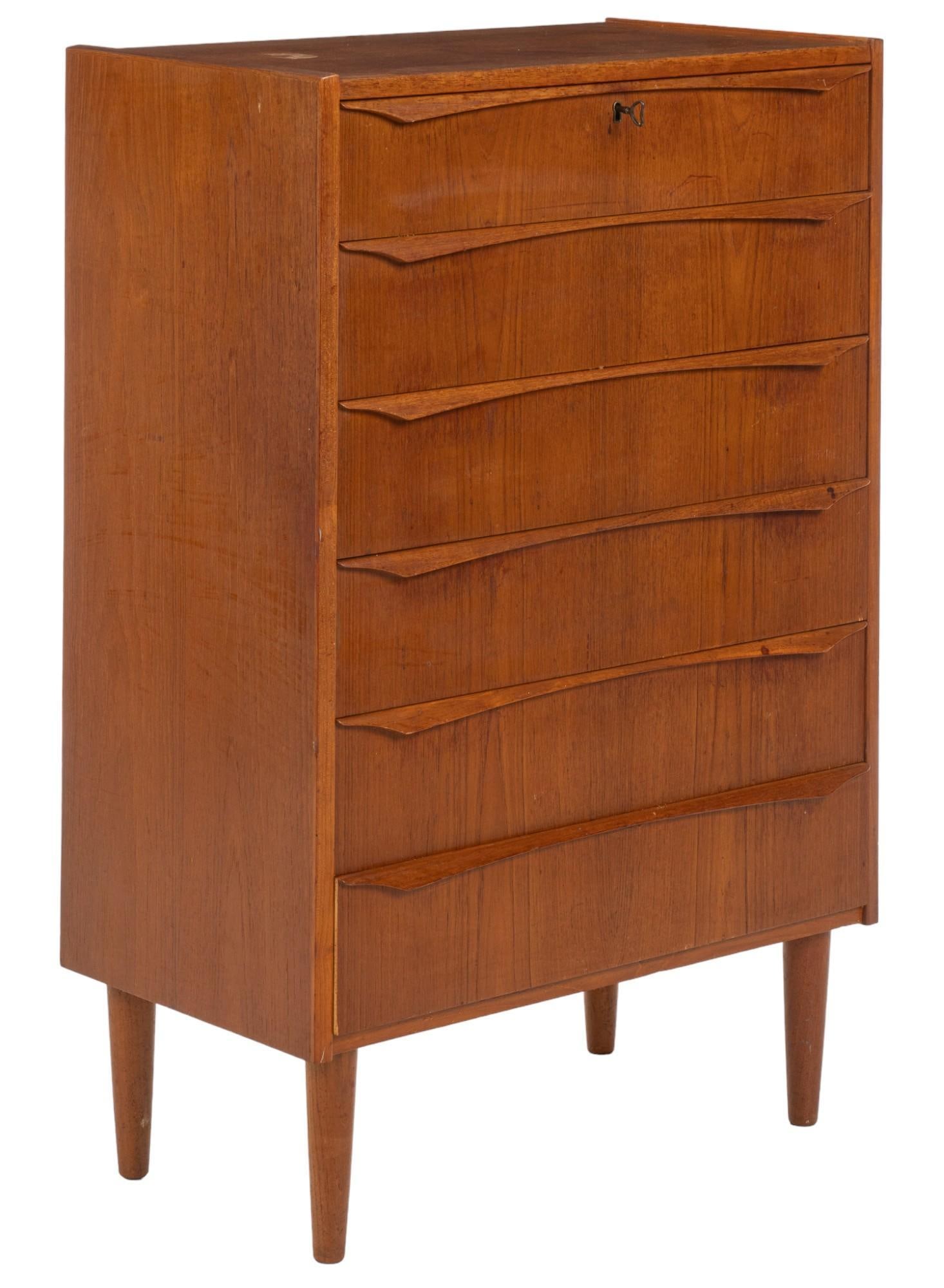 Danish Mid-Century Chest of Drawers: Danish mid-century chest of six drawers with wood pulls, with top drawer featuring key lock, supported on pin legs, includes key height 42.5 in. x width 28 in. x depth 15.5 in. Shipping available for 