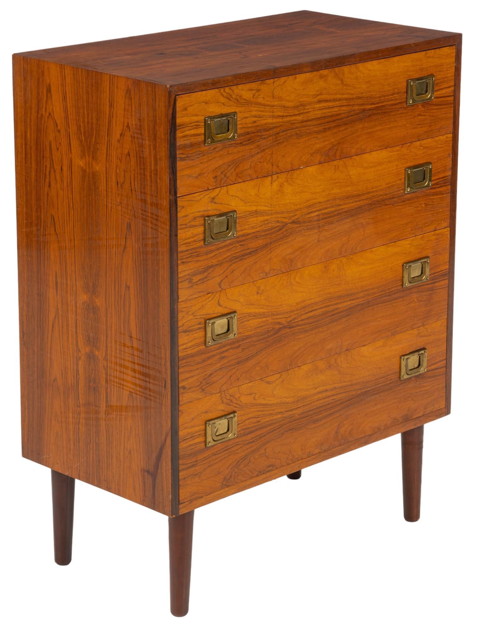 Danish Mid-Century Chest of Drawers: Danish mid-century chest of four stacked drawers with metal ring pulls, supported on pin legs height 35.5 in. x width 27.5 in. x depth 15 in. Shipping available for this lot through our partner 4CL; p
