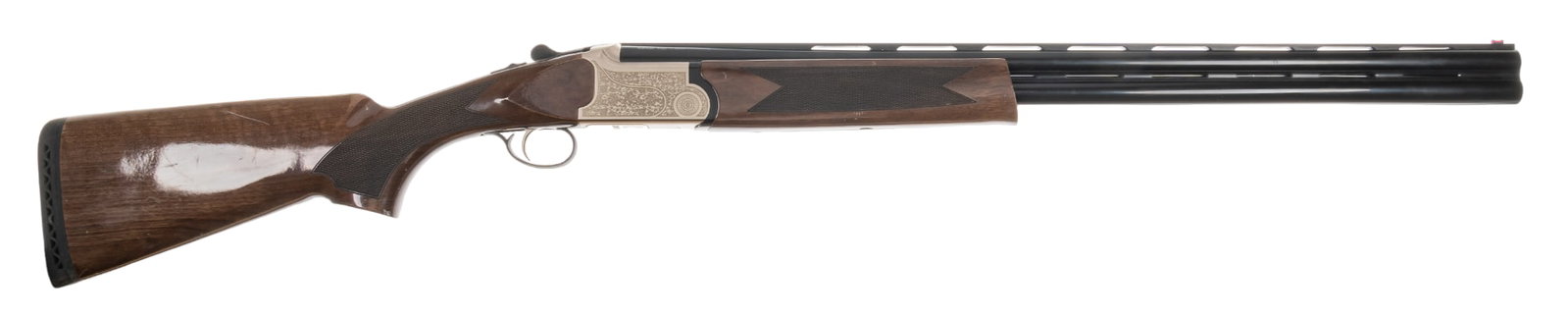 Tristar Setter 12 Gauge Over Under Shotgun: Serial: KRU058401 Manufacturer: Kral-Turkey / Tristar Model: Setter Caliber: 12 Gauge (3 in. chamber) Barrel length: 28 in. (Removable chokes, Imp Cyl, Mod) OAL: 45.5 in. Condition: Very Good - Good: 