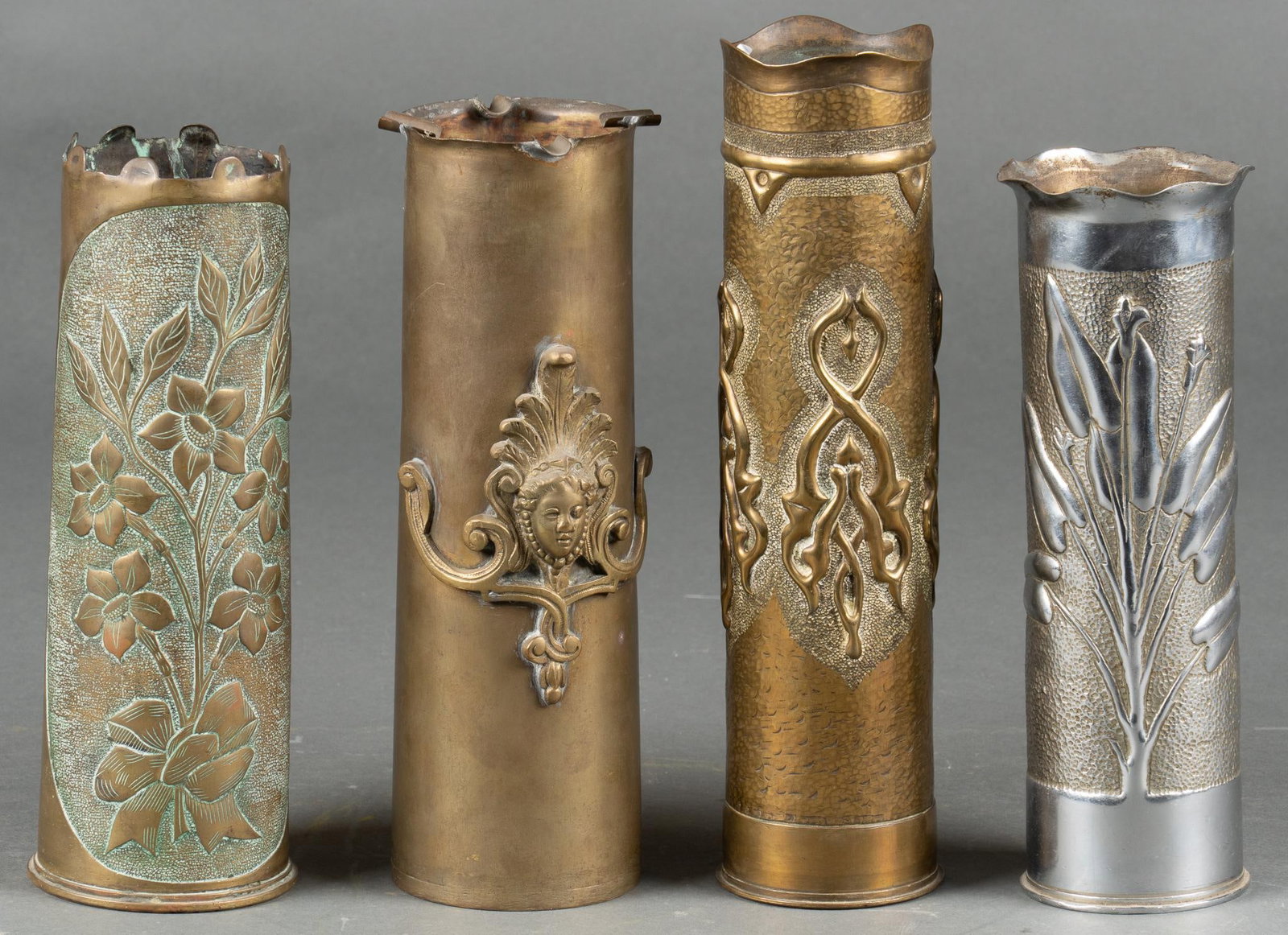Set of 4 Highly Engraved WWI Trench Art Vases: Includes: 2- French 75mm casings, one nickel plated 2- British 18 Pounder Casings Longest: 13 in. Shipping available for this lot through our partner 4CL; please request a shipping quote at shipping&#