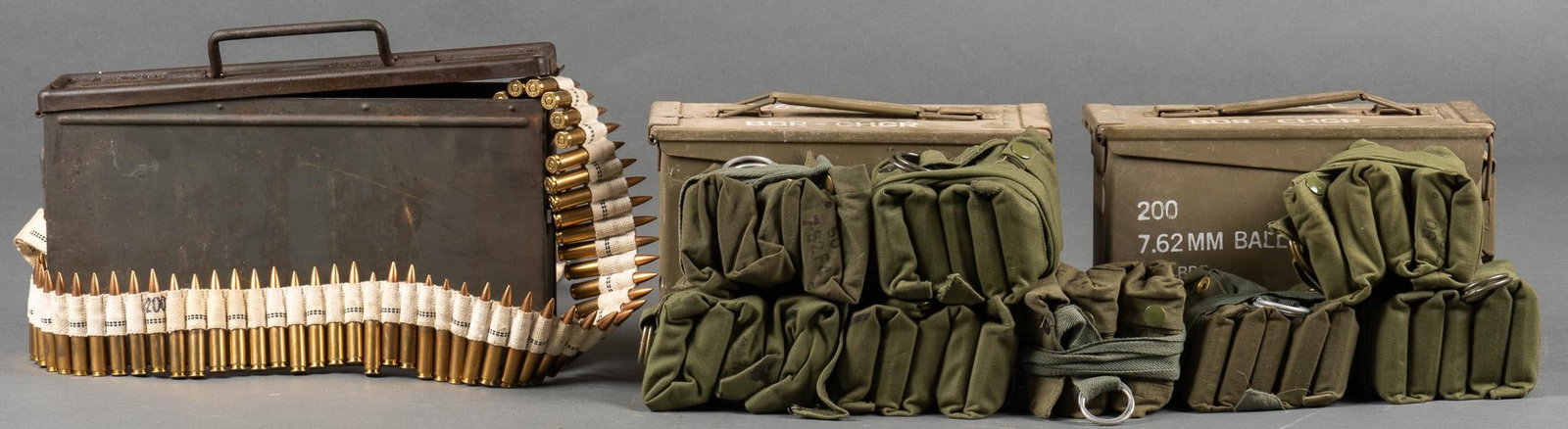 600 Rounds of Australian & Portuguese 7.62 NATO Ammunition: Includes: 3 cans of mixed 7.62 NATO -2 cans (400 rds) 7.62x51 NATO FMJ Australian in bandoleers -1 can (200 rds) Portuguese 7.62x51 NATO FMJ on canvas belt Provenance: A Highland Oaks, Texas estate Sh