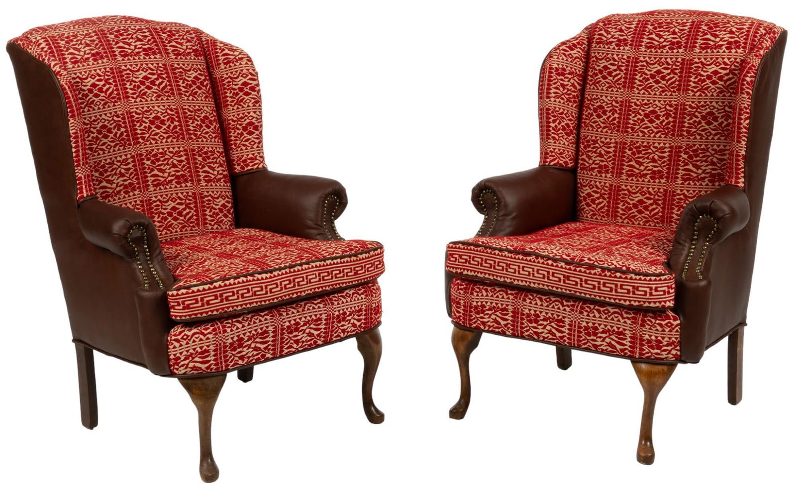 Pair of Arm Chairs: Pair of armchairs of brown leather, with metal nail head accents, with red and white fabric upholstery, with floral motif, supported on cabriole legs height 43.5 in. x width 31 in. x depth 30 in. Pr