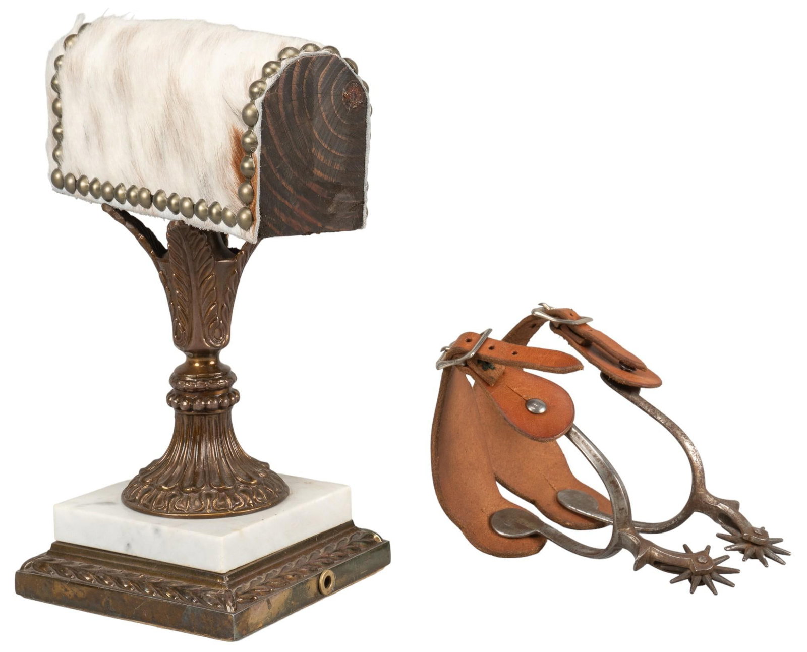 Cowhide and Marble Spur Stand and Spurs: Cowhide and marble spur stand with pair of spurs, marble base with ornate metal details on the leg of the stand, wood stand with cowhide lining and metal fastenings on the border of stand, pair of spu