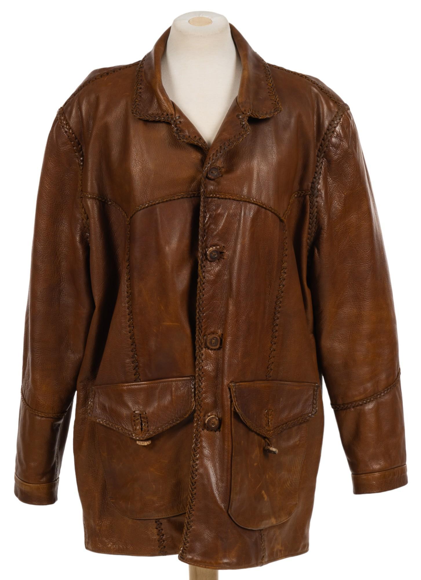 Alan Michael Brown Leather Coat: Alan Michael (USA) brand brown leather coat, whip stitch trim, overall length 36 in. x shoulder width 24 in. sleeve length 25 in. Condition A; excellent condition, shows little signs of wear Provena