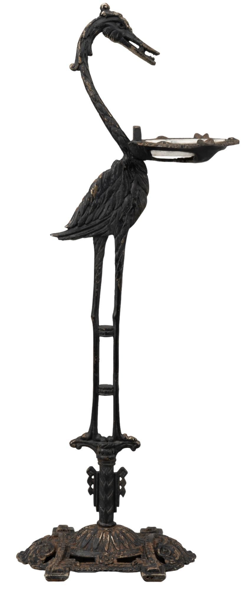 Wrought Iron Cigar Stand: Wrought iron cigar stand featuring heron design, with marble disc ashtray height 36.5 in. x width 12 in. x depth 9 in. Provenance: Property from the estate of a San Antonio, Texas gentleman Shippi