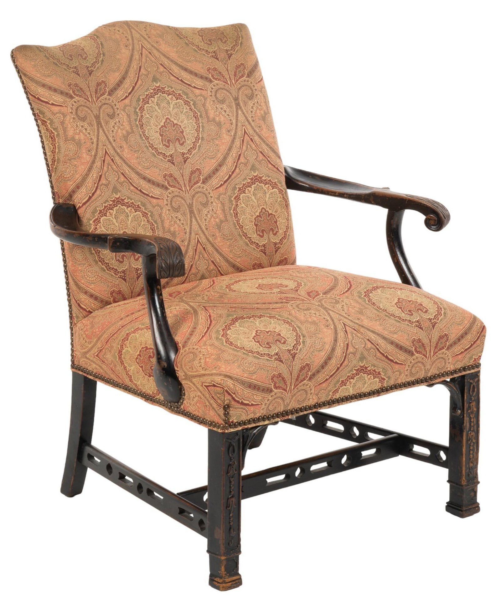 Vintage Armchair: Vintage armchair featuring serpentine crest, carved armrests with scroll and leaf accents, with embroidered upholstery with symmetrical scroll design, fixed to frame with metal nail head accents, supp