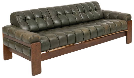 Vintage Leather Sofa: Vintage sofa featuring wooden frame supporting three seats with removable tufted cushions of aged green leather upholstery  height 26 in. x width 80 in. x depth 30 in.  Shipping available for this lot