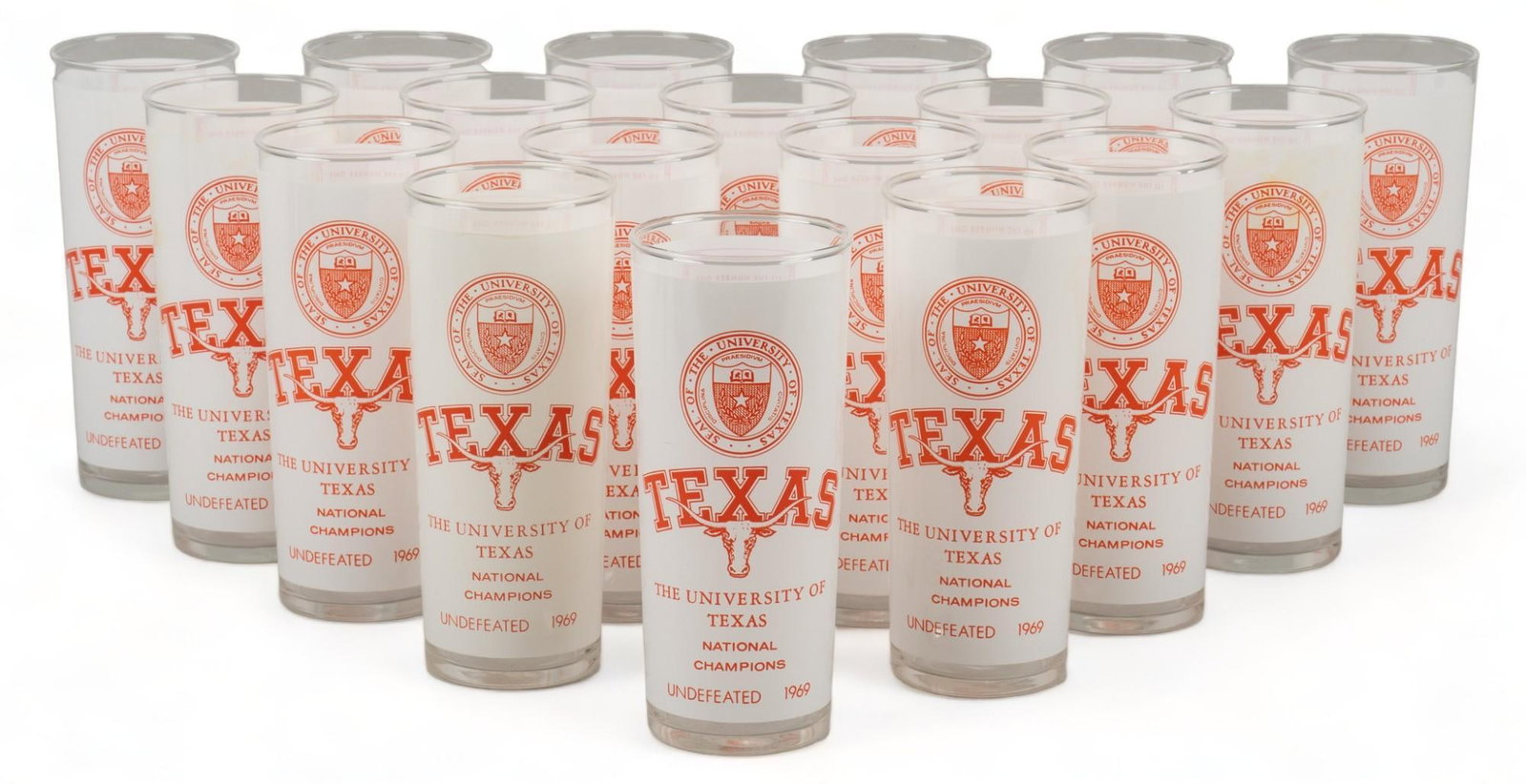 (18) University of Texas Highball Glasses: Collection of eighteen (18) vintage University of Texas highball glasses height 7 in. x diameter 3 in. / each Provenance: Property from the estate of a San Antonio, Texas gentleman Shipping available 