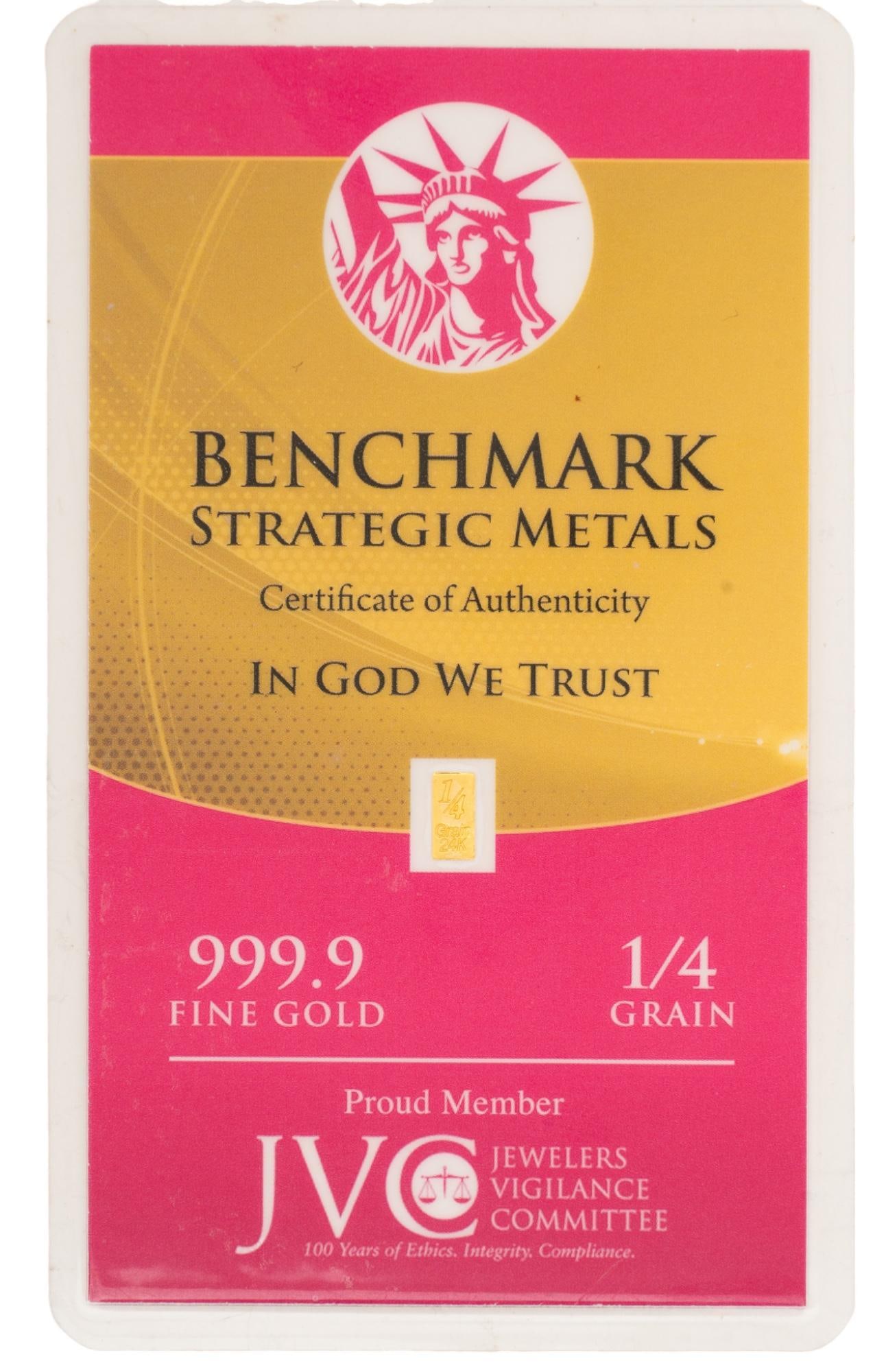 24K Gold "1/4 Grain" Bullion Benchmark Strategic Metals: 24K gold "1/4" grain bullion from Benchmark Strategic Metals, gold piece inside laminated certificate of authenticity, 1/4 fine grade gold Provenance: Property from the estate of a San Antonio
