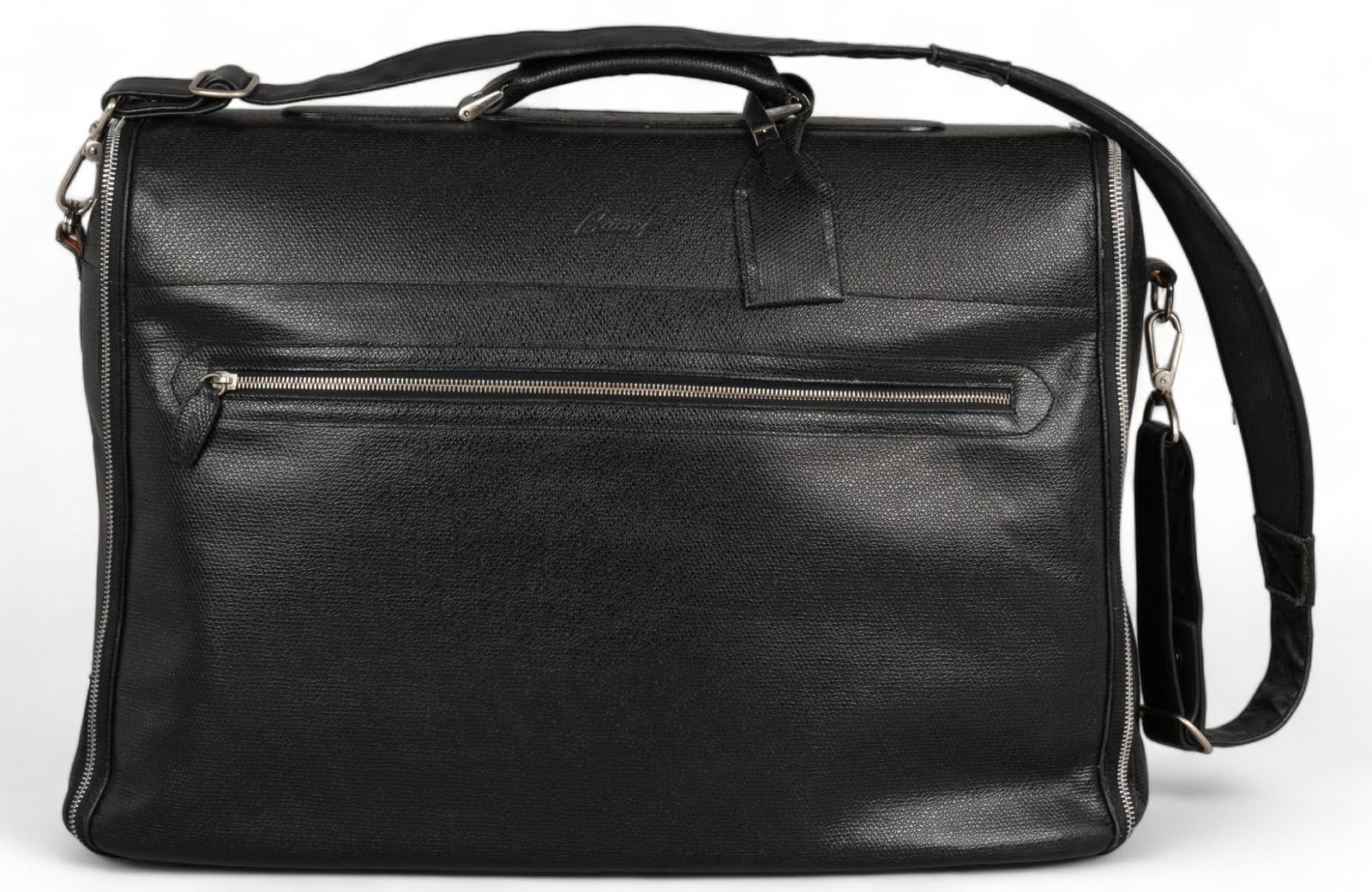 Brioni Black Leather Weekend Bag: Brioni weekend bag of black leather, with silver-toned metal hardware, includes leather handle, shoulder strap, and luggage tag height 16 in. x width 23 in. x depth 5 in. Condition B; good conditio