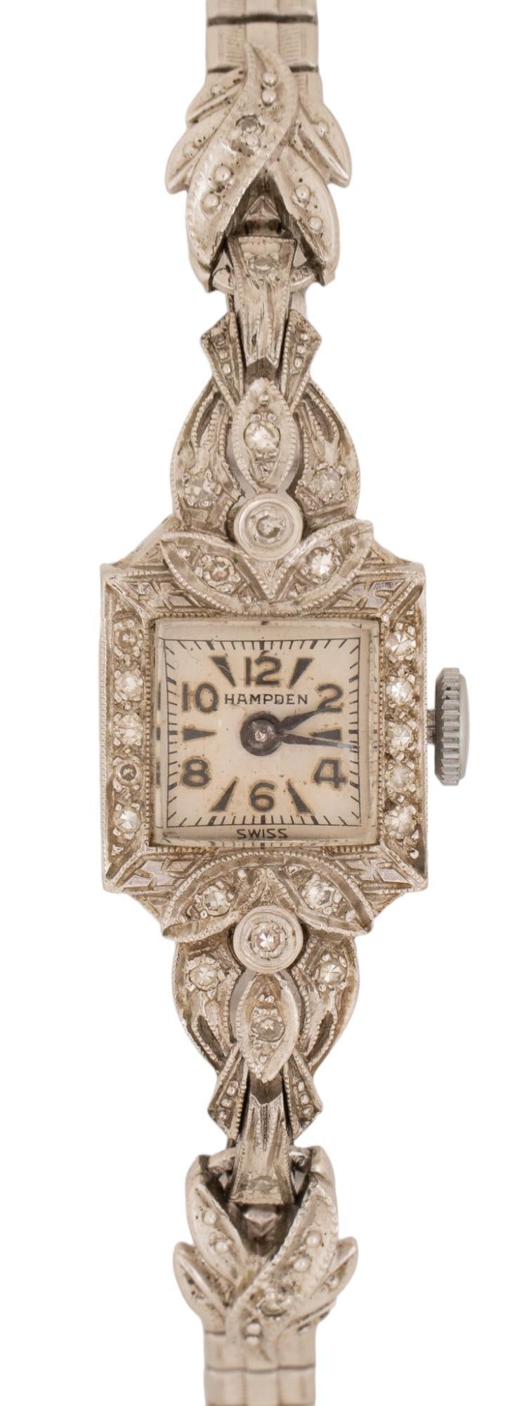 Antique Hampden Watch WB Dial Sterling Band: Hampden watch with WB dial and sterling band, inlaid diamond details on watch face, diamonds inlaid into floral motifs, marked on watch face "Hampden" Circumference: 8 in Provenance: Property 
