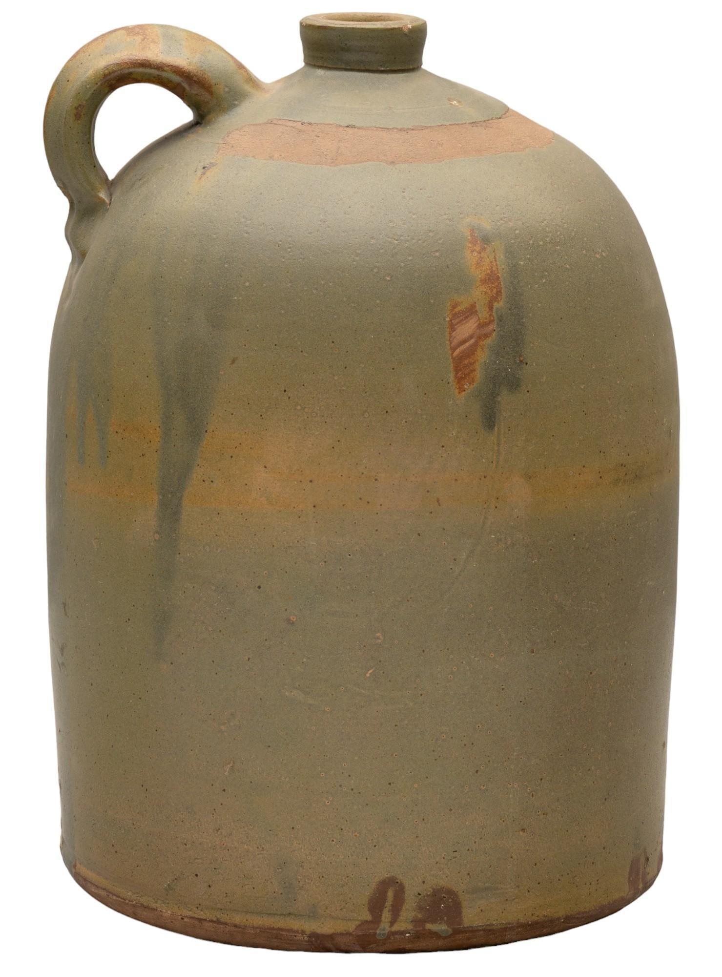 Meyer Pottery, Rare Light Green 3 Gal. Jug: Meyer Pottery (Atascosa, Texas), 3 gallon handled jug, rare light green Leon slip glaze, ceramic height 17 in. x 12 in. diameter Shipping available for this lot through our partner 4CL; please request