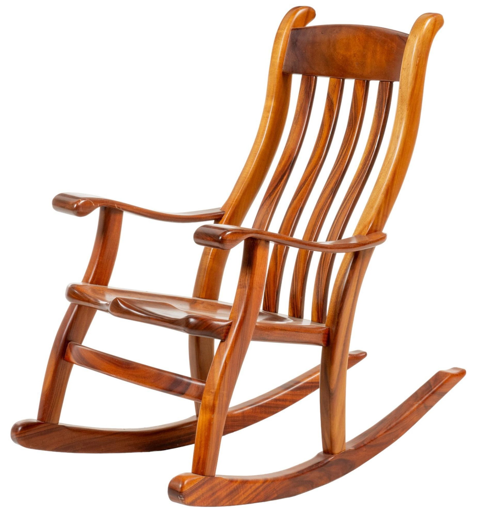 Oak Rocking Chair: Ranch style oak rocking chair with lath style slat back, supported on rockers height 41 in. x width 40.4 in. x depth 24 in. Provenance: Property from the monumental lifetime collection of a distinguis