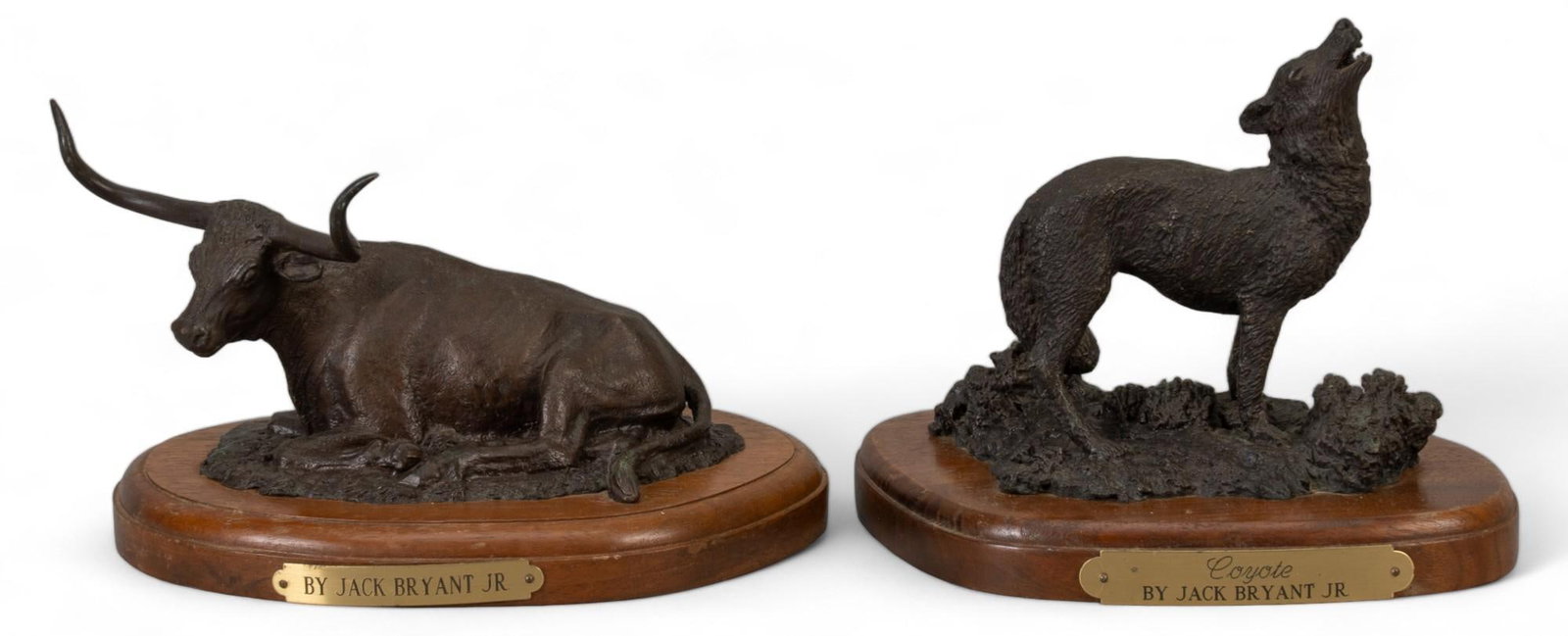 Jack Bryant, Longhorn and Coyote: Jack Bryant, (2) bronze sculptures, to include "Longhorn" Foundry Copy and "Coyote" 12/20, 1985, atop wooden bases height 4 in. x width 6.5 in. x depth 5 in. Shipping available for thi