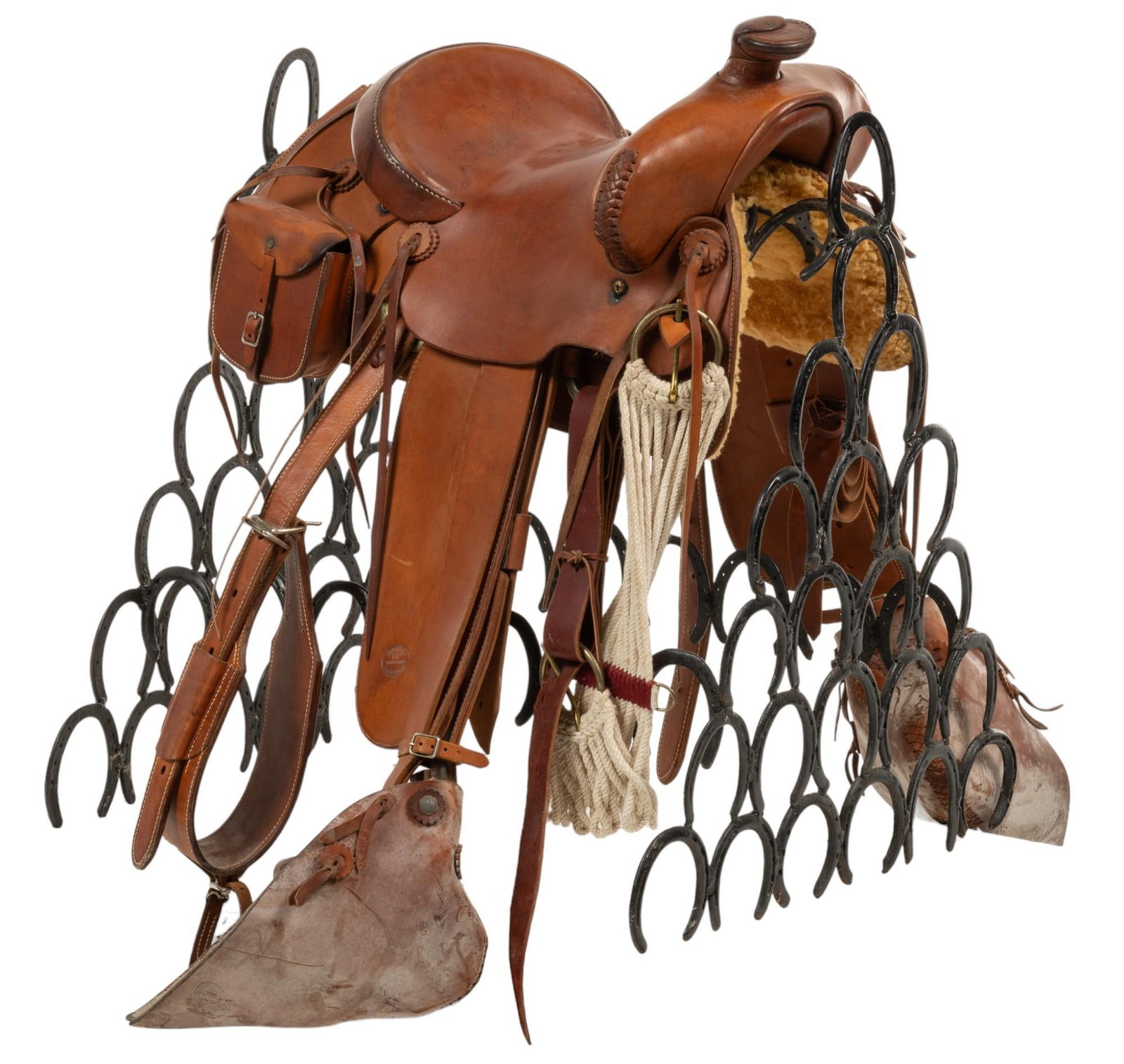 King Ranch Saddle and Stand: King Ranch saddle, saddle with matching breast collar, hooded leather stirrups, mohair cinch, set of saddle bags height 41 in. x width 27 in. x depth 38 in. / saddle height 28 in. x width 32 in. x dep