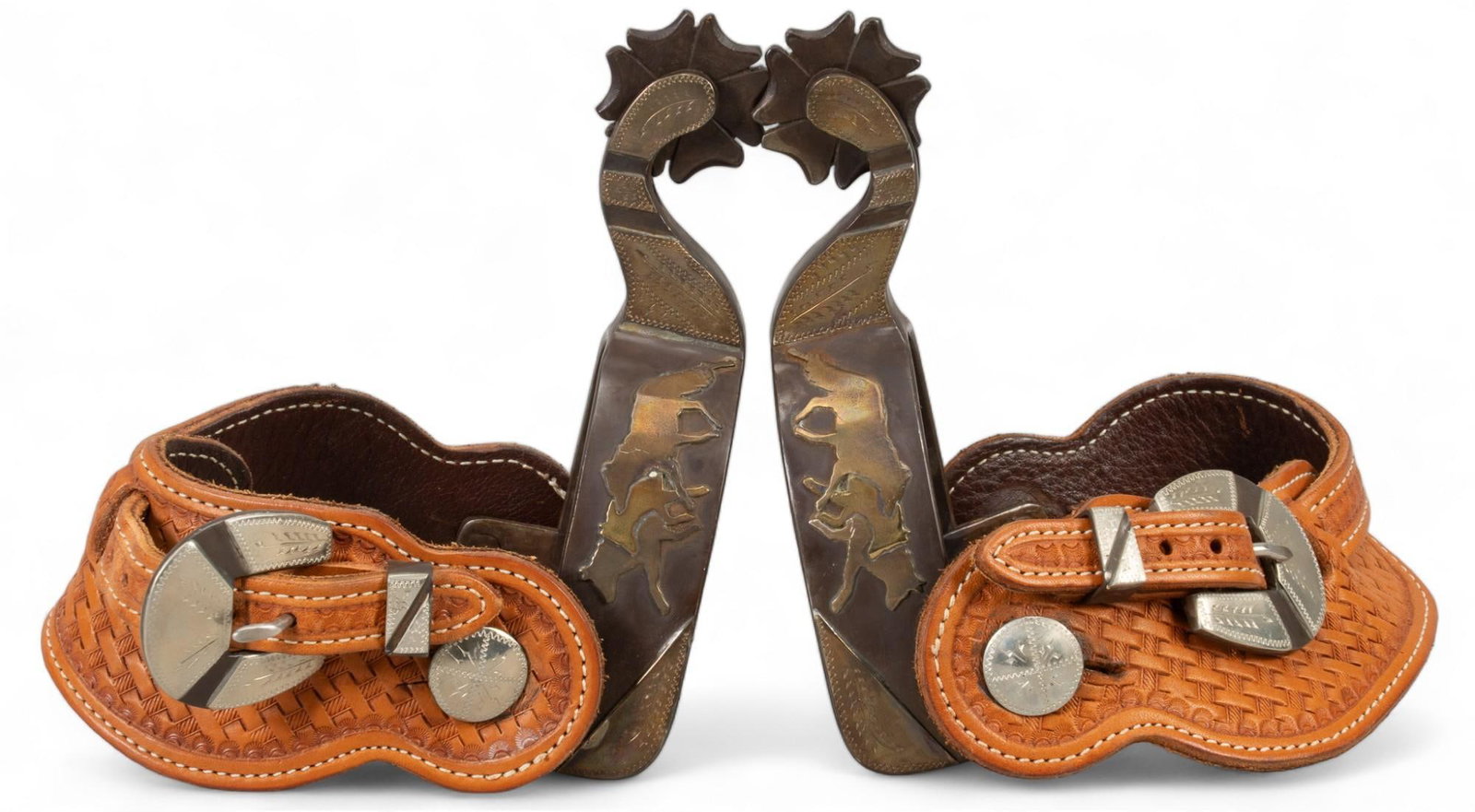 Pair of Payne Brand Double Silver Mounted Spurs: Pair of Payne brand double silver mounted spurs, wolves and paw print pattern on both sides of the heel band, clover rowels, monogrammed leather strap, marked "Payne 2064" heel strap shank len
