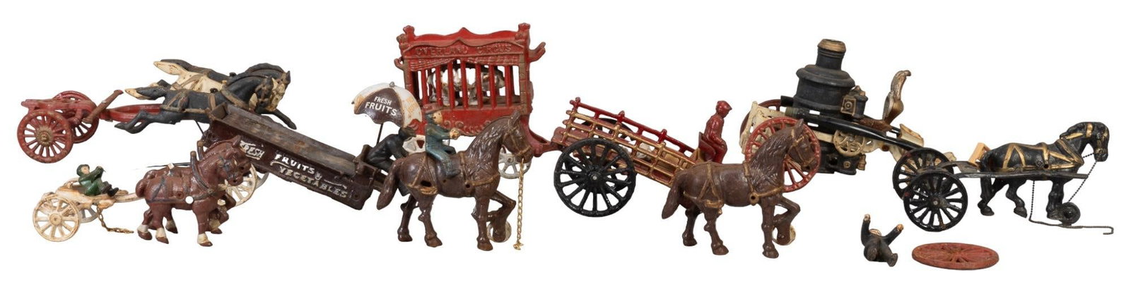 Collection of Vintage Cast Iron Toys: Collection of vintage cast iron circus / traveling troupe toys, featuring horse carriages, circus bear, and fruit salesman height 7 in. x width 5 in. x depth 13 in. / largest piece Shipping available 