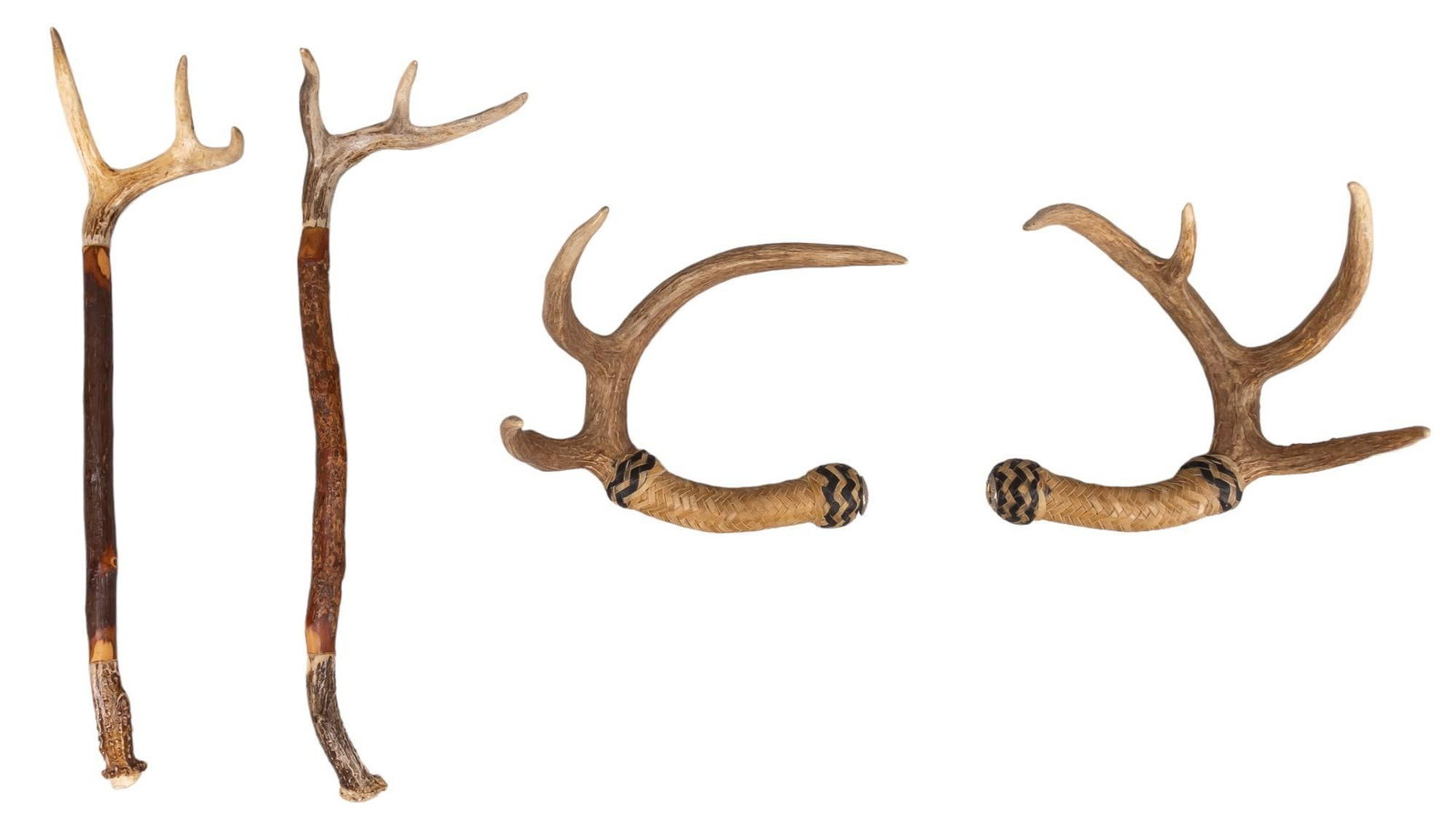 Set of (4) Antler Tools: Set of four antler tools, two have antler ends with wood handles and two have rawhide handles on end of antlers height 21 in. x width 6 in. x depth 5 in. Provenance: Property from the monumental lifet