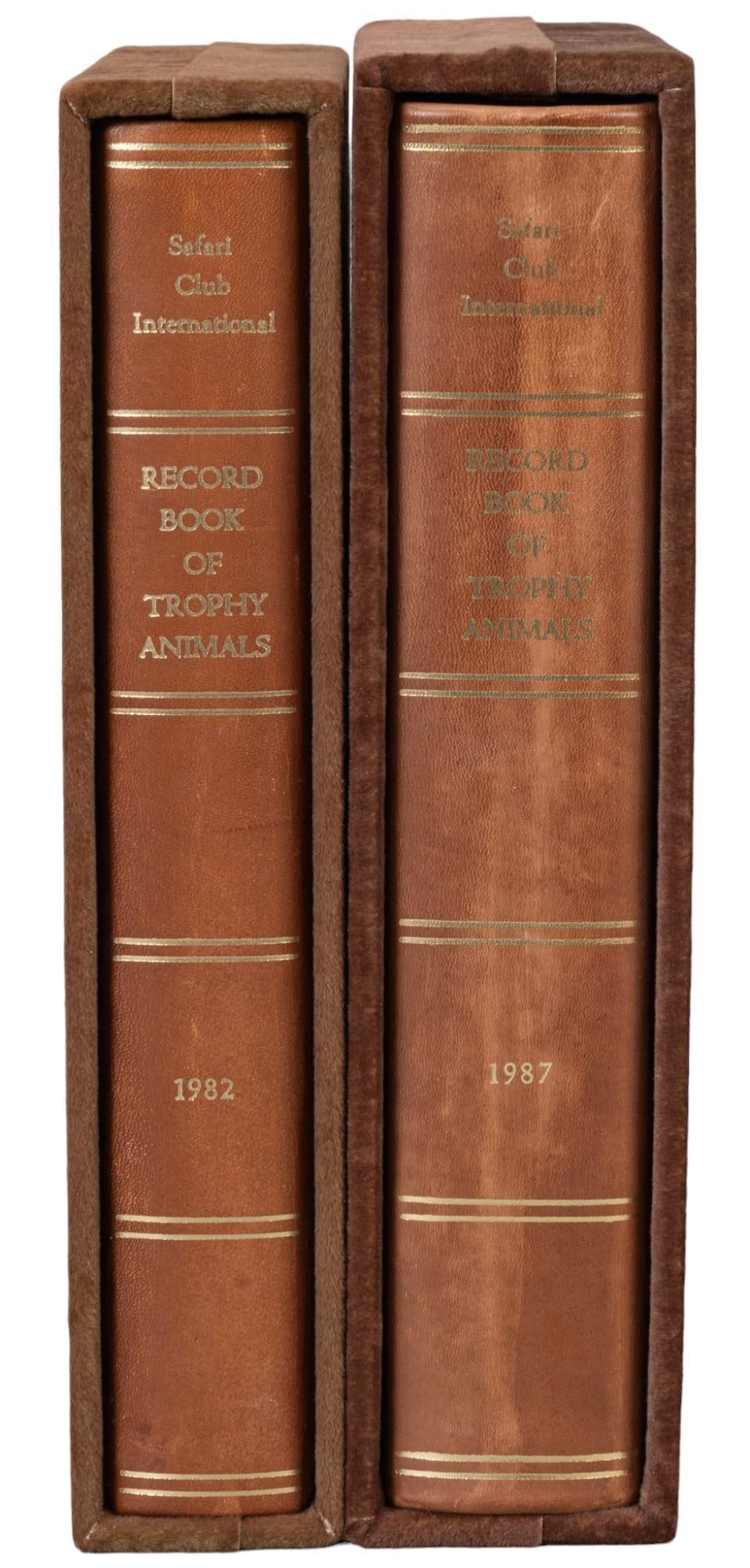 Two Volumes of the Record Book of Trophy Animals: Two volumes of the Record Book of Trophy Animals, volumes from the years 1987 and 1982, includes signatures of participants in hunts of these two years and kept in two velvet cases height 12 in. x wid